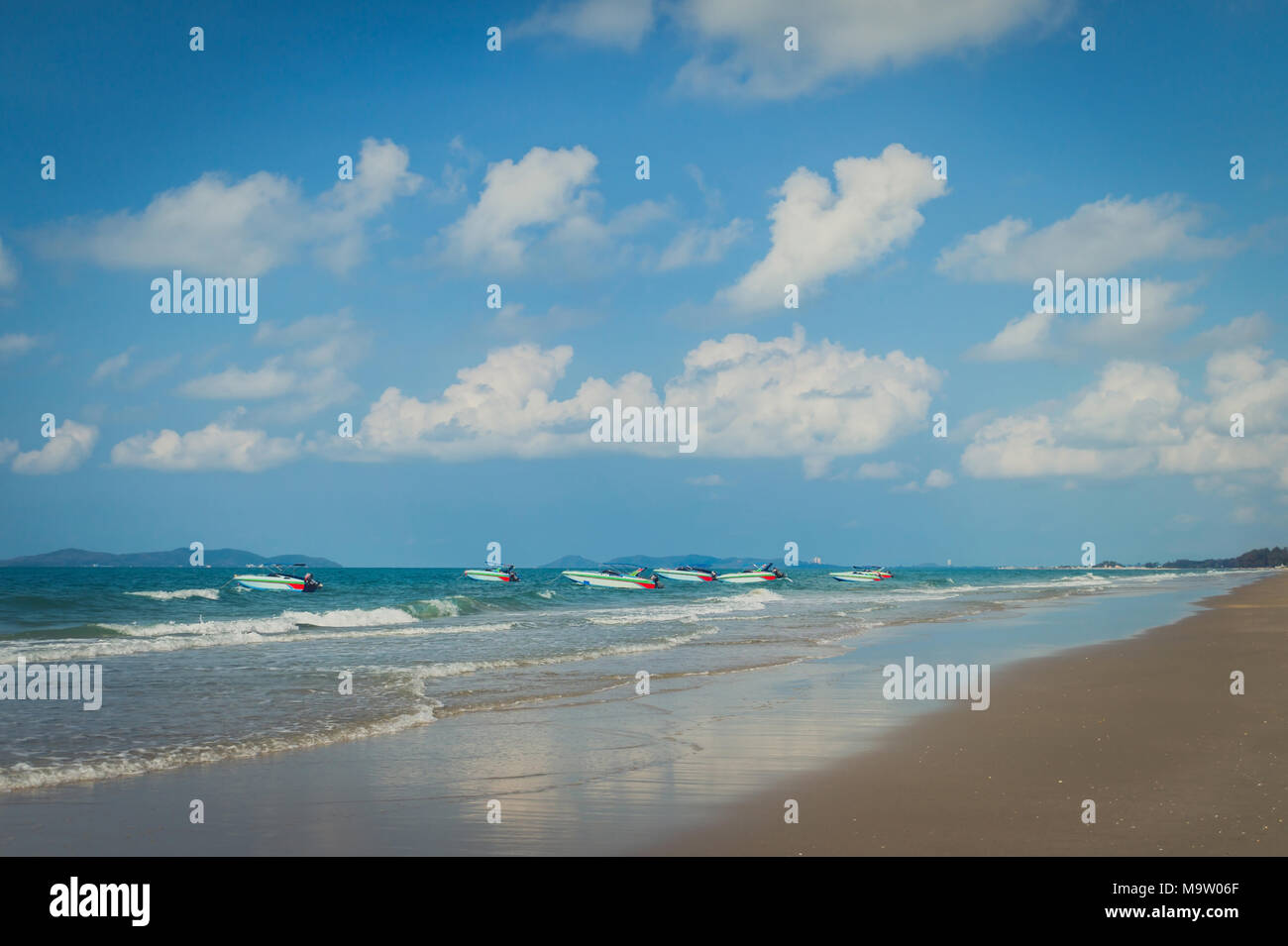 Tropical beach with clear water , blue sky and speed boats Stock Photo ...