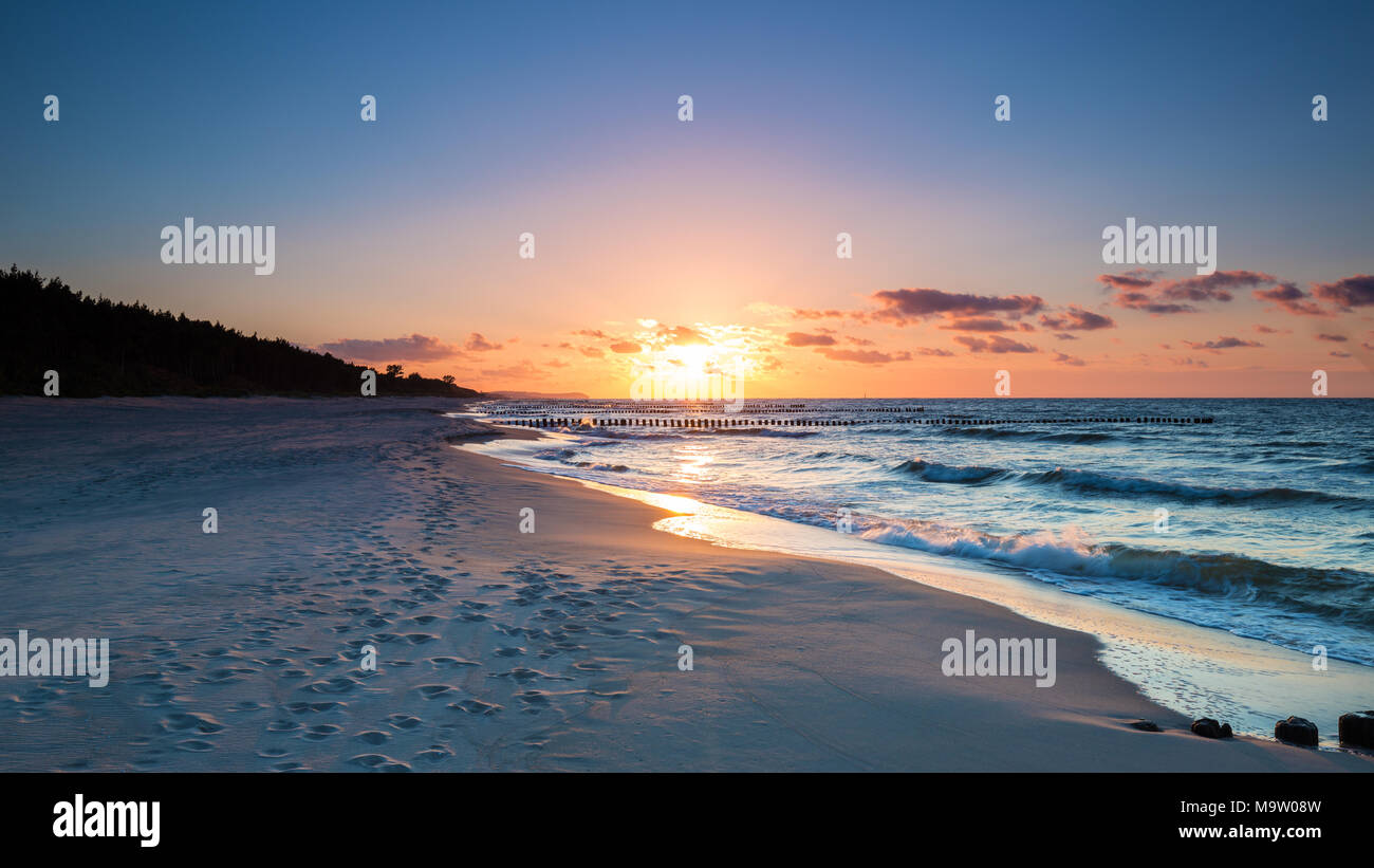Sunset on the beach of the Baltic Sea Stock Photo