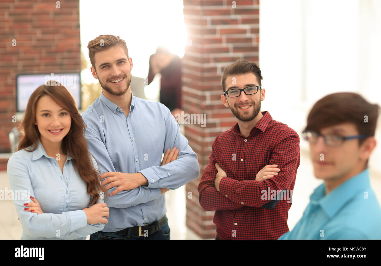 Happy smiling business team in office Stock Photo - Alamy
