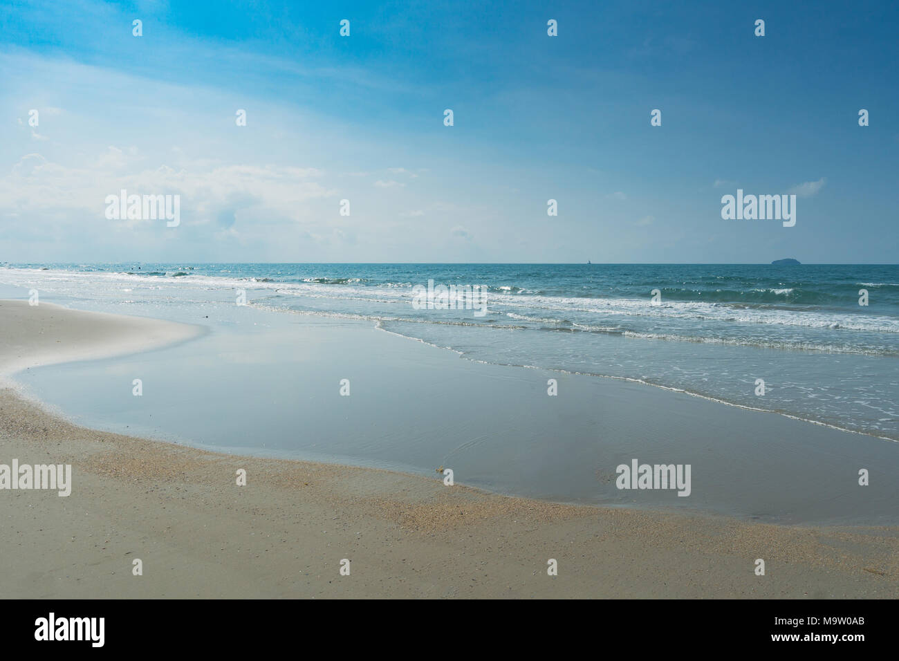 Tropical beach with clear water and blue sky Stock Photo - Alamy