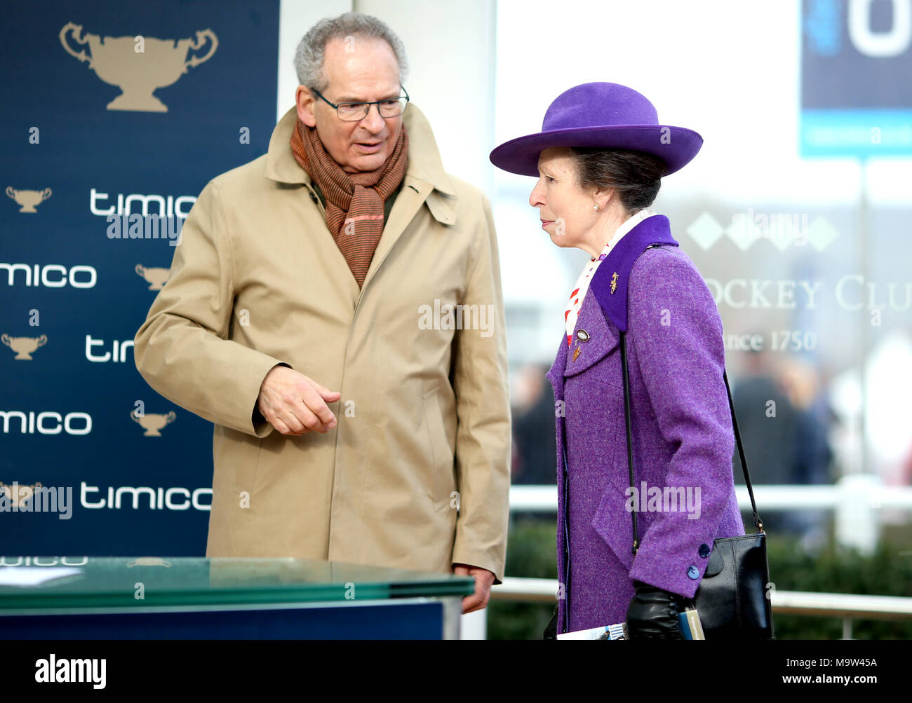 The Princess Royal and Robert Waley-Cohen on stage ready to present the  Timico Cheltenham Gold Cup to winning owners Anne and Garth Broom during  Gold Cup Day of the 2018 Cheltenham Festival