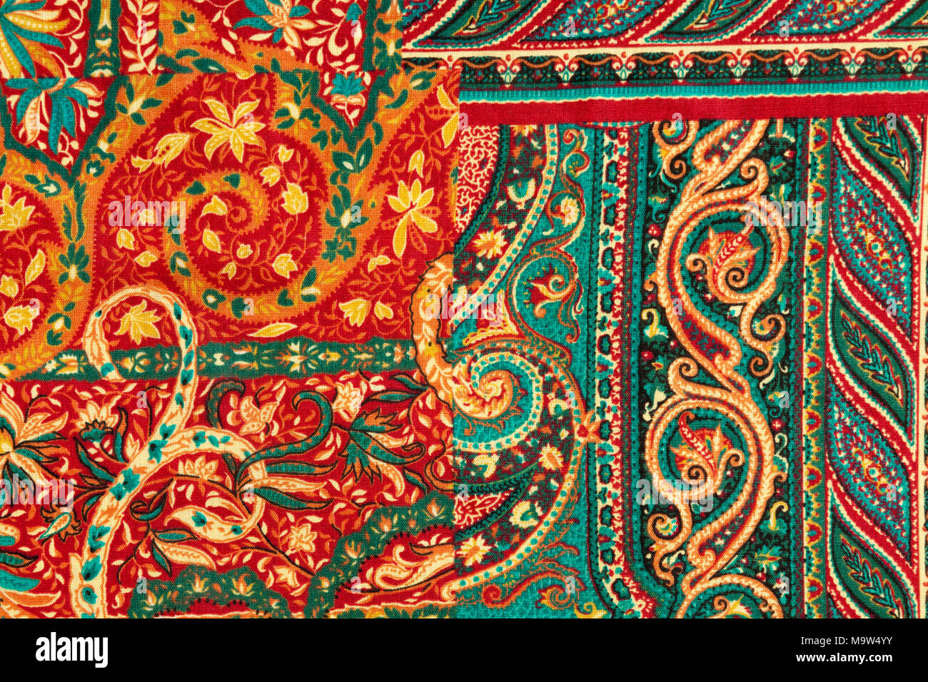 Detail shot of a piece of fabric with a vibrant abstract Paisley pattern - a floral design with scrolls Stock Photo