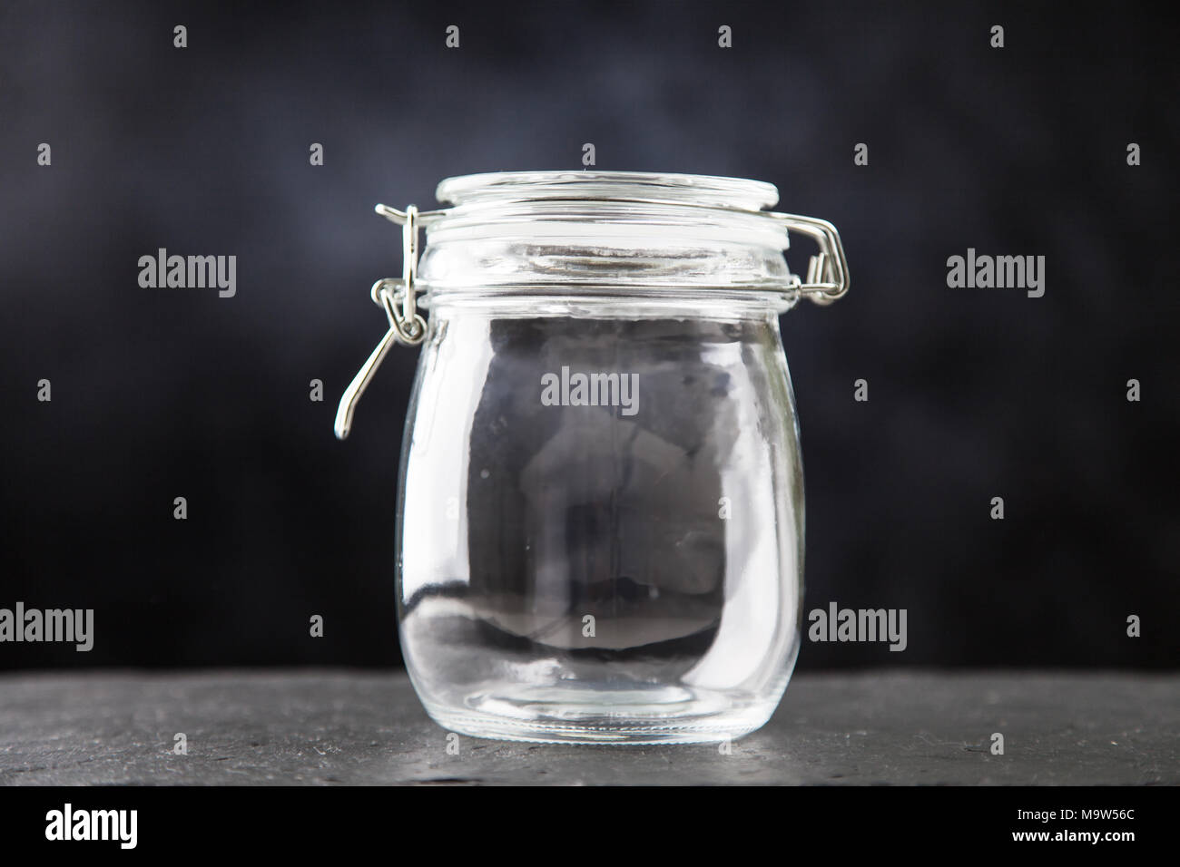 Glass jar on dark background Stock Photo