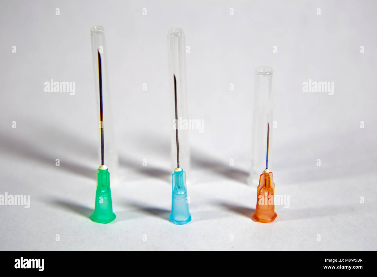 Hypodermic needles and caps in various sizes Stock Photo Alamy