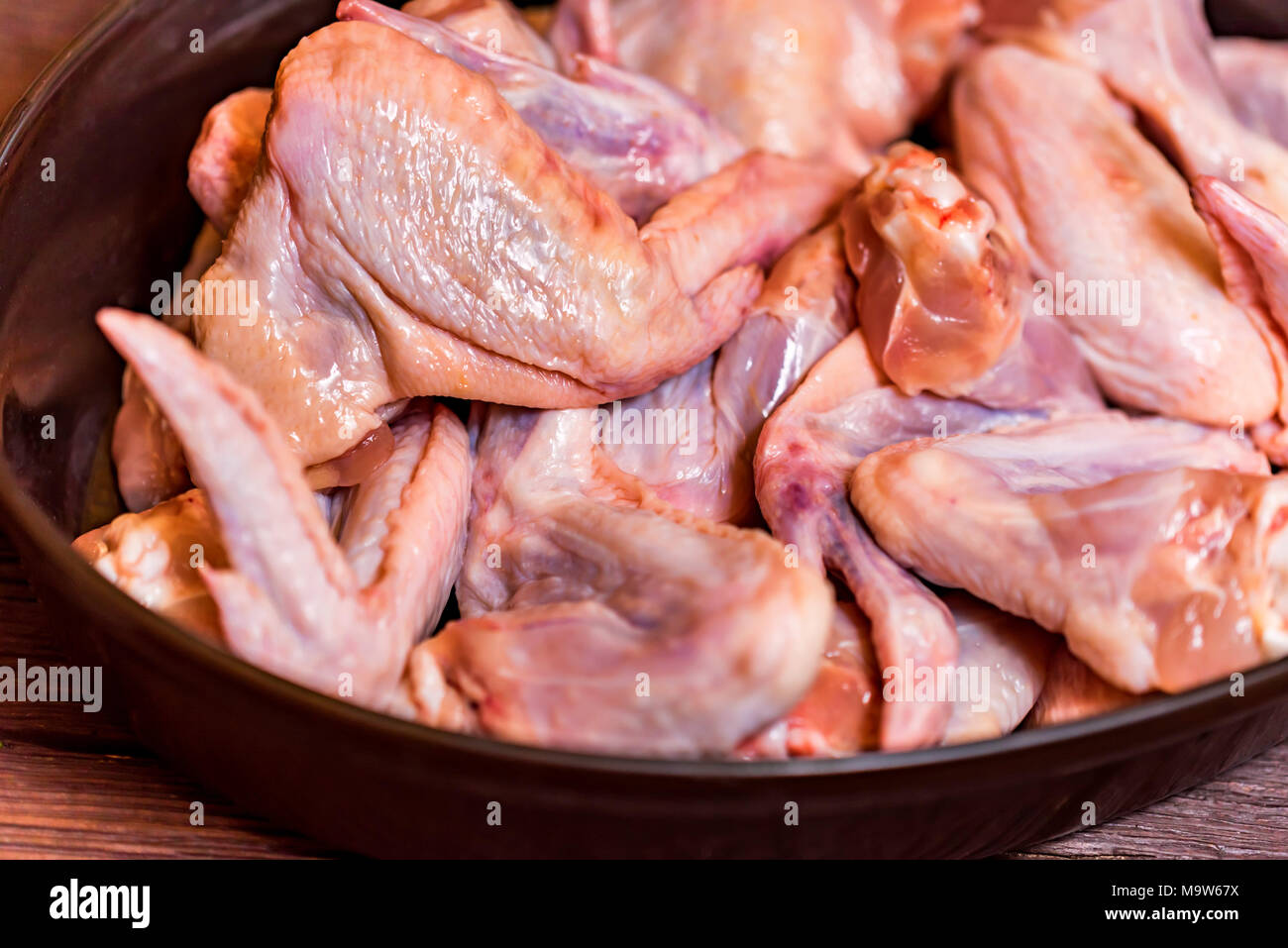 Fresh raw chickens wings in frying pan Stock Photo Alamy
