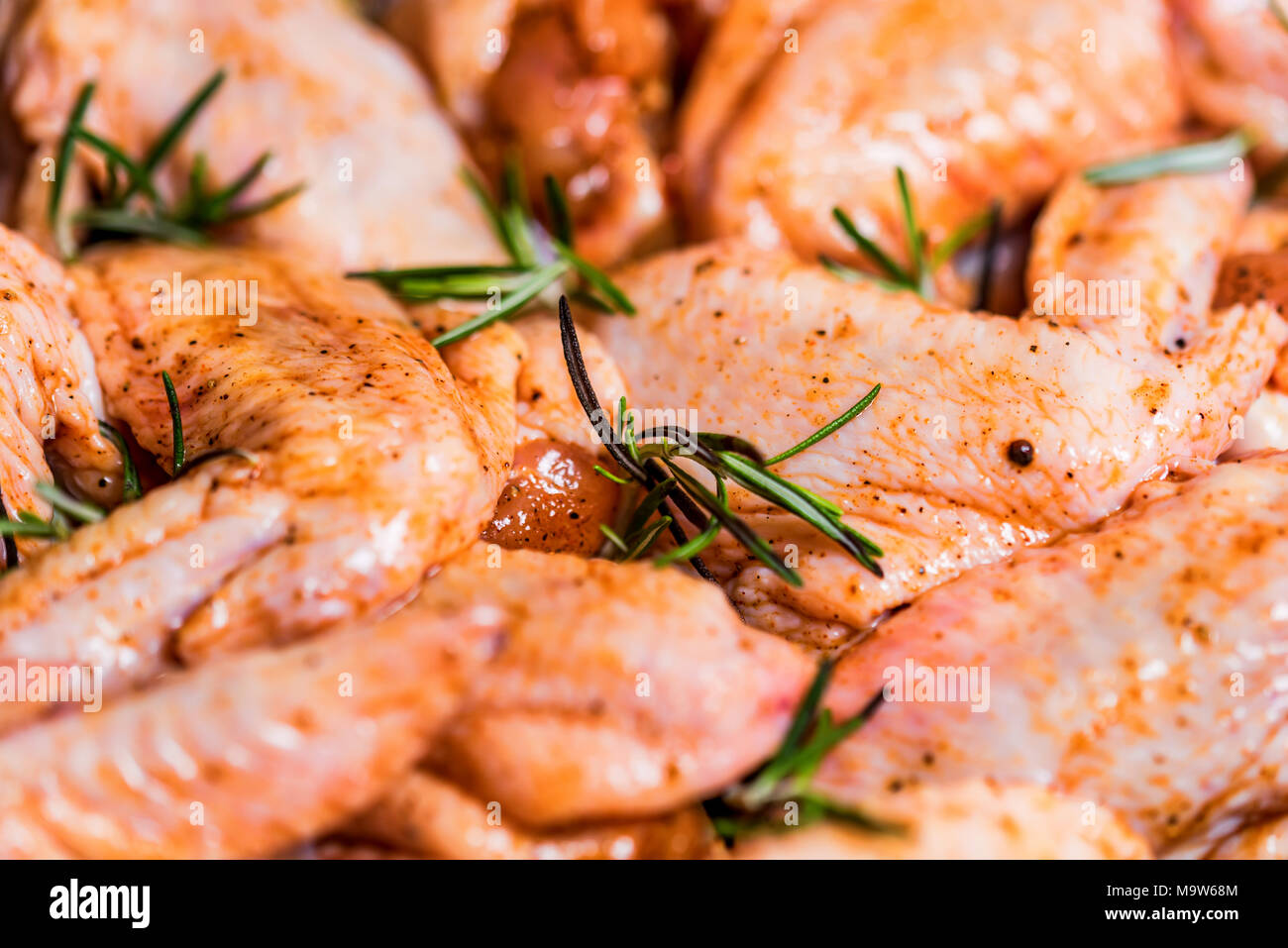 Fresh chickens wings covered in honey and spices Stock Photo