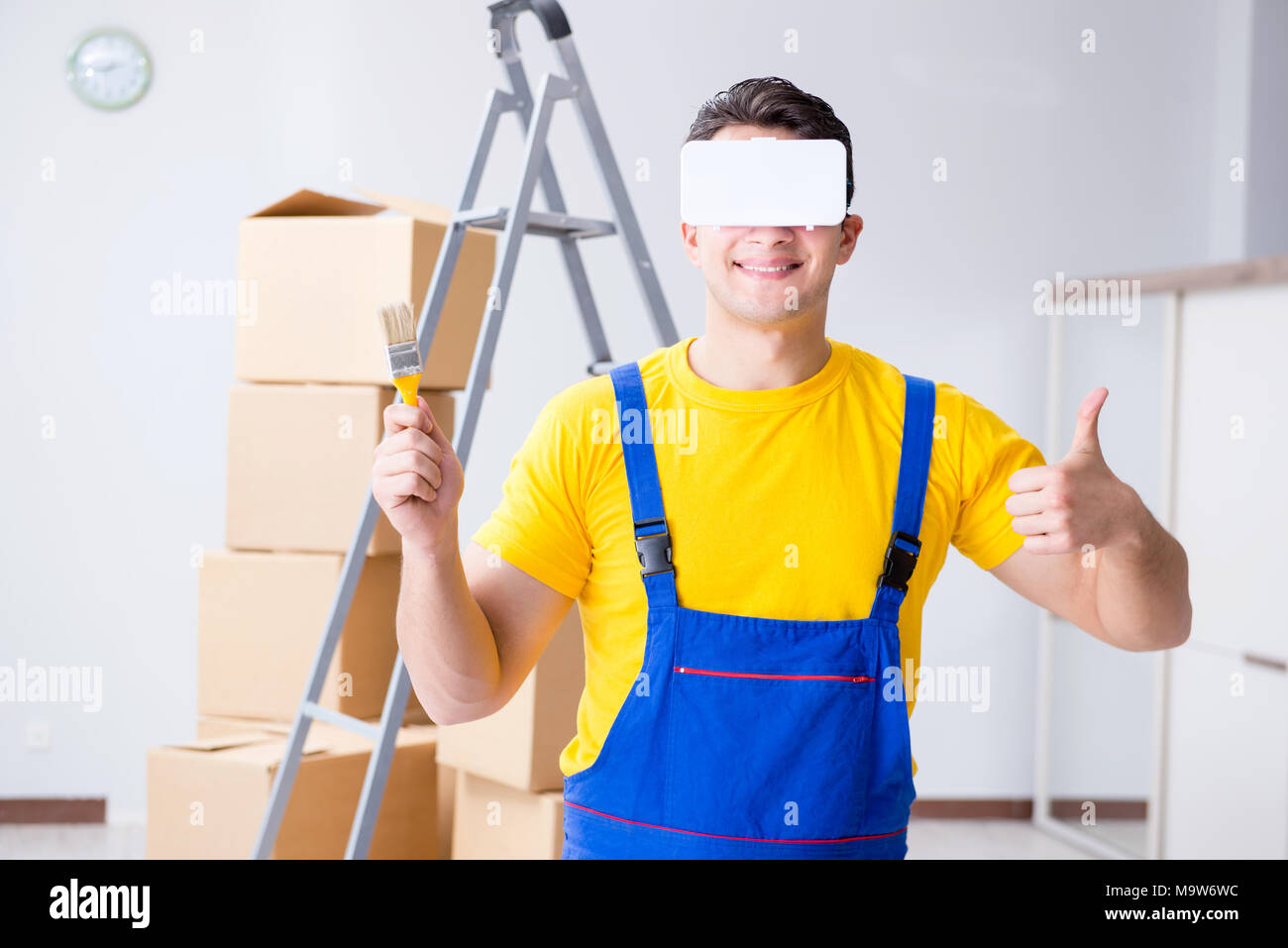 Painter contractor working with virtual reality goggles Stock Photo