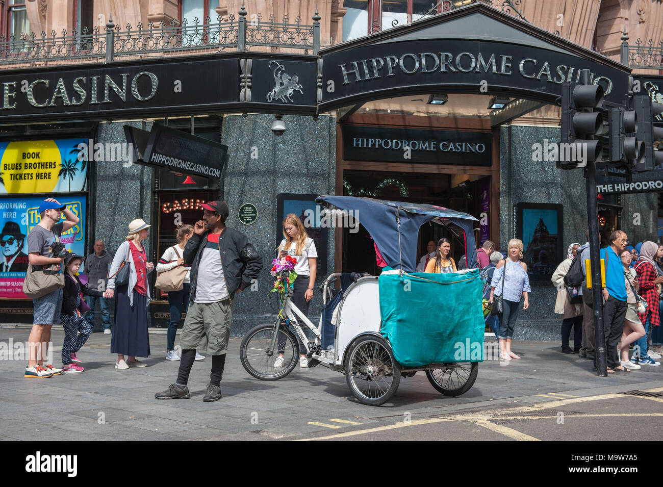 London. rickshaw in front of the Hippodrome Casino, Leicester Square. United Kingdom. Stock Photo