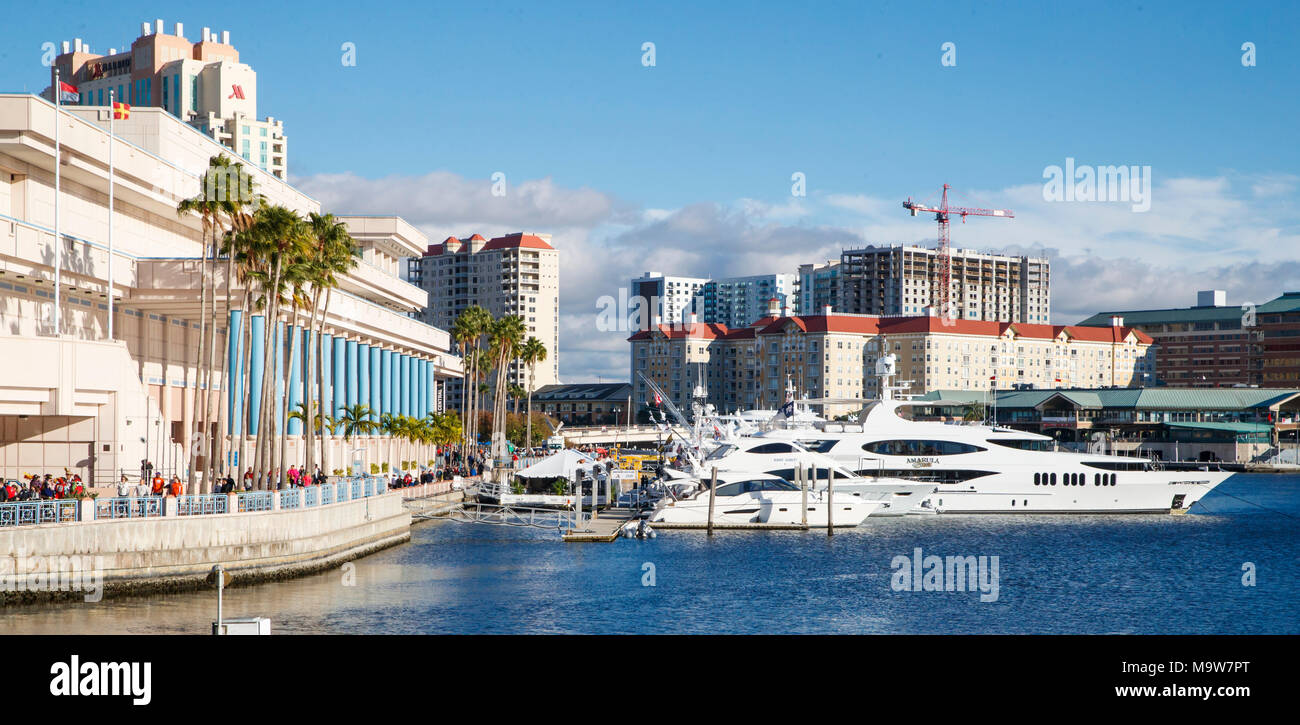 Yachts are docked along Hillsborough River in front of the Tampa Convention Center during the 2017 College Football Playoff in Tampa, Florida. Stock Photo