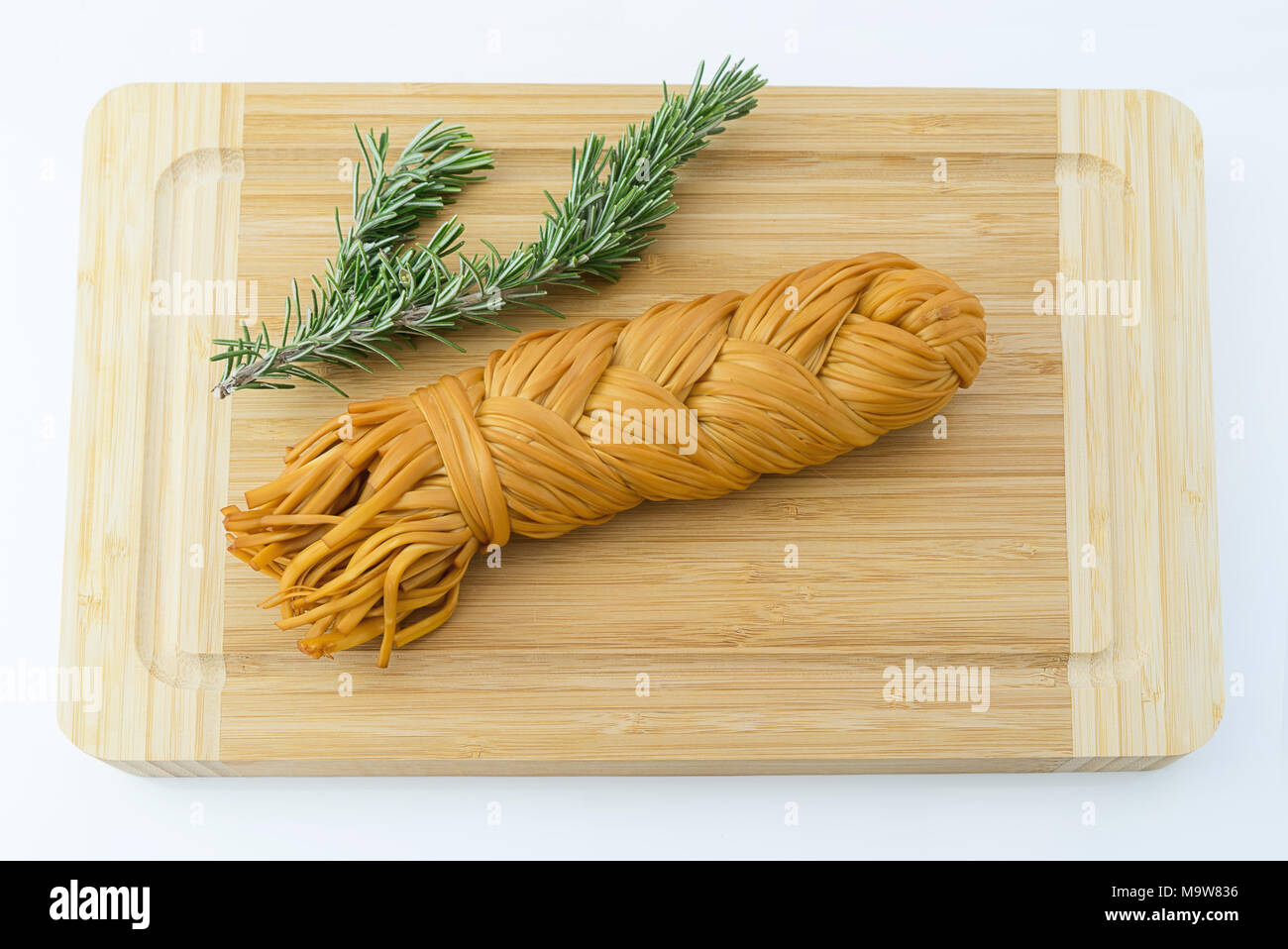 Armenian chechil smoked cheese on cutting board Stock Photo - Alamy