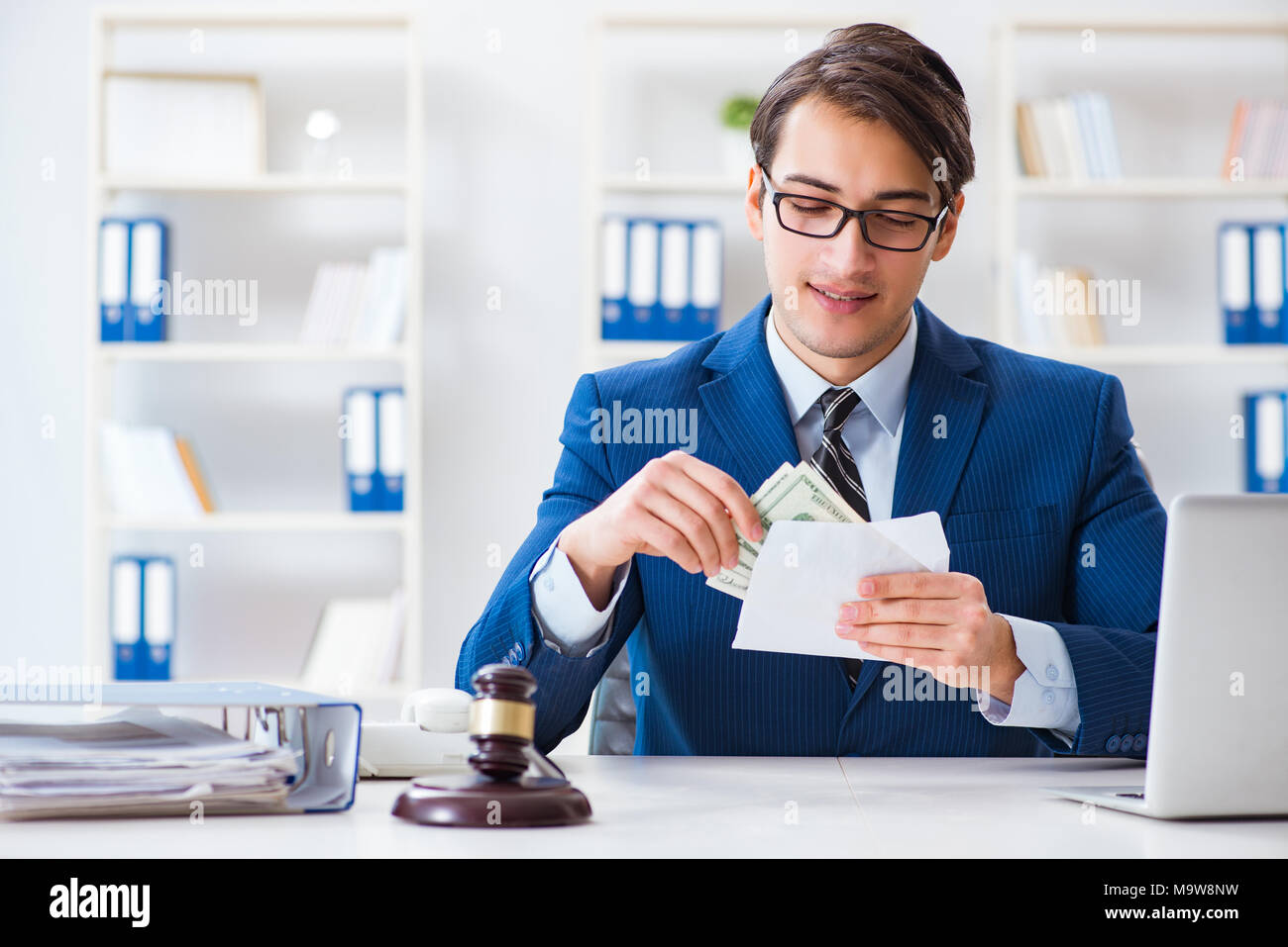 Lawyer receiving money as bribe Stock Photo Alamy
