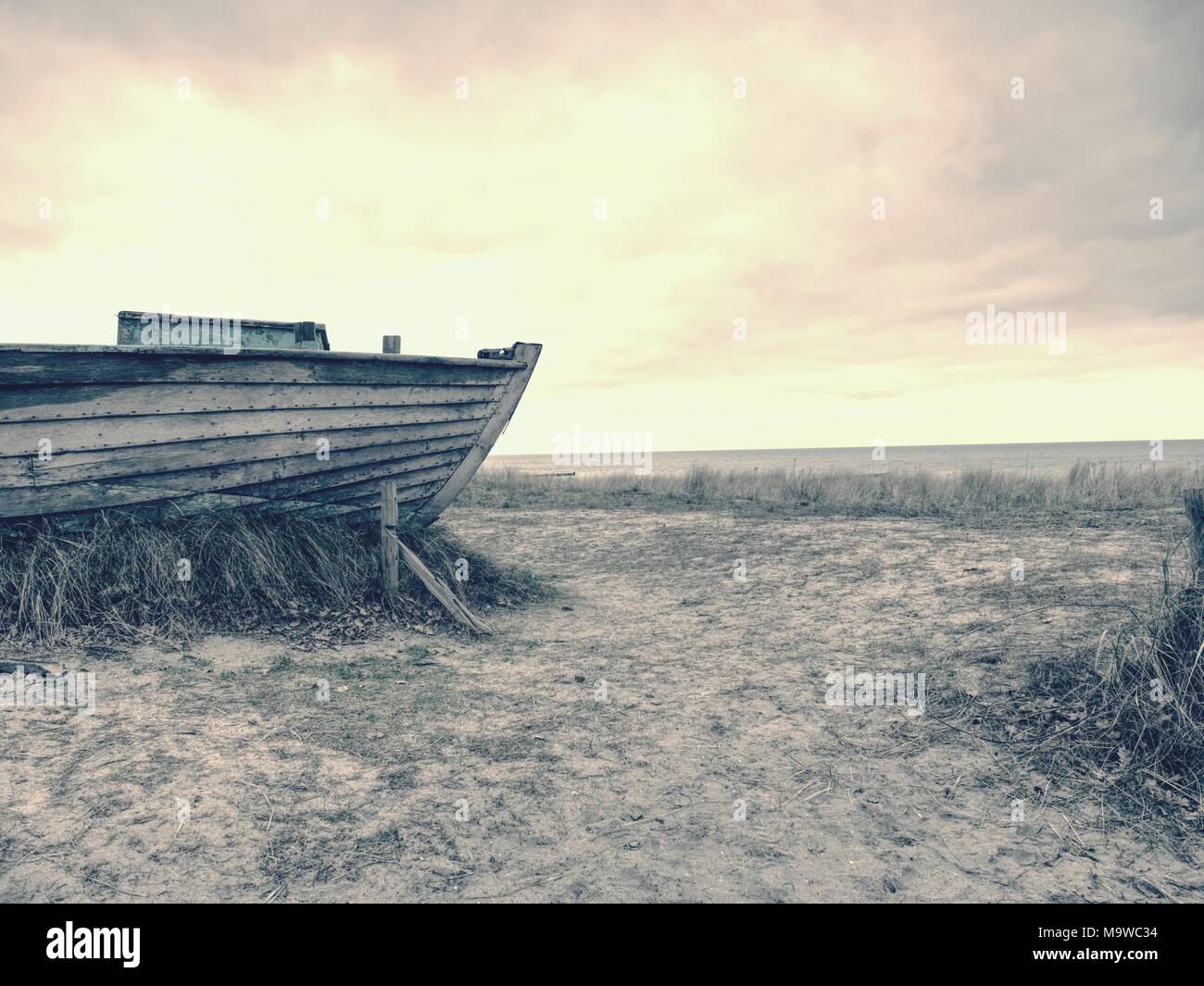 Abandoned wrecked boat stuck in sand. Old wooden boat on the sandy ...