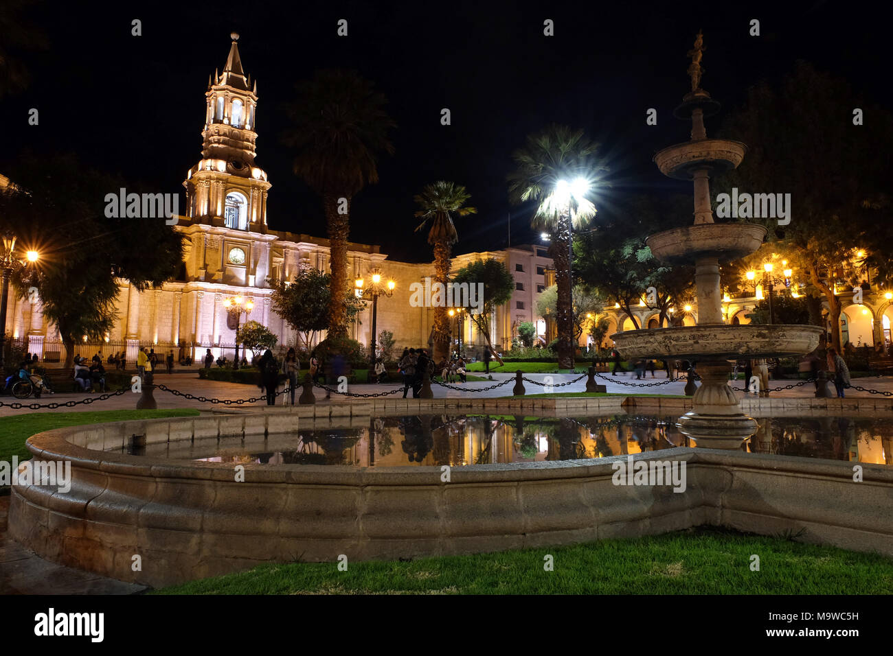 The Plaza de Armas in Arequipa at night with the fountain in the foreground Basilica Cathedral of Arequipa illuminated in the background. Stock Photo