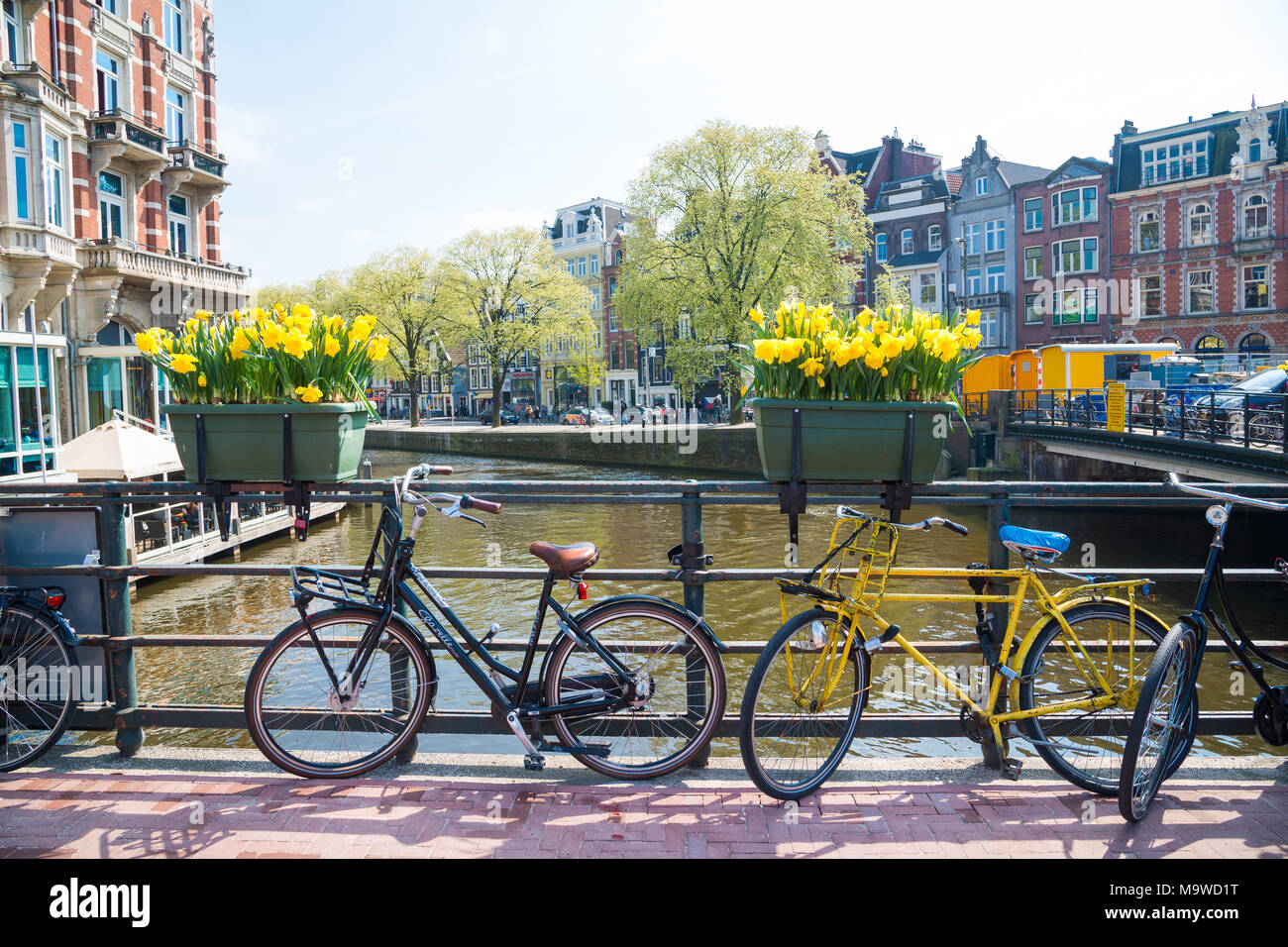 Amsterdam, Netherlands - April 20, 2017: Bicycles parked on a bridge in Amsterdam, The Netherlands Stock Photo