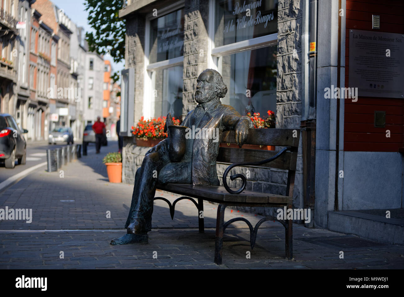 Dinant, Belgium. Statue of Adolphe Sax, inventor of the saxophone, located in the street of the same name. Sculptor: Jean-Marie Mathot (2001). Stock Photo