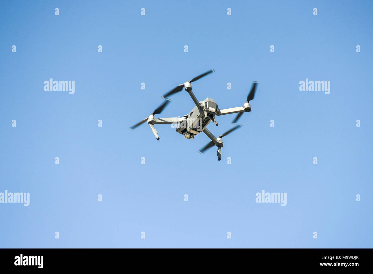 drone flying during the day on a blue sky background Stock Photo
