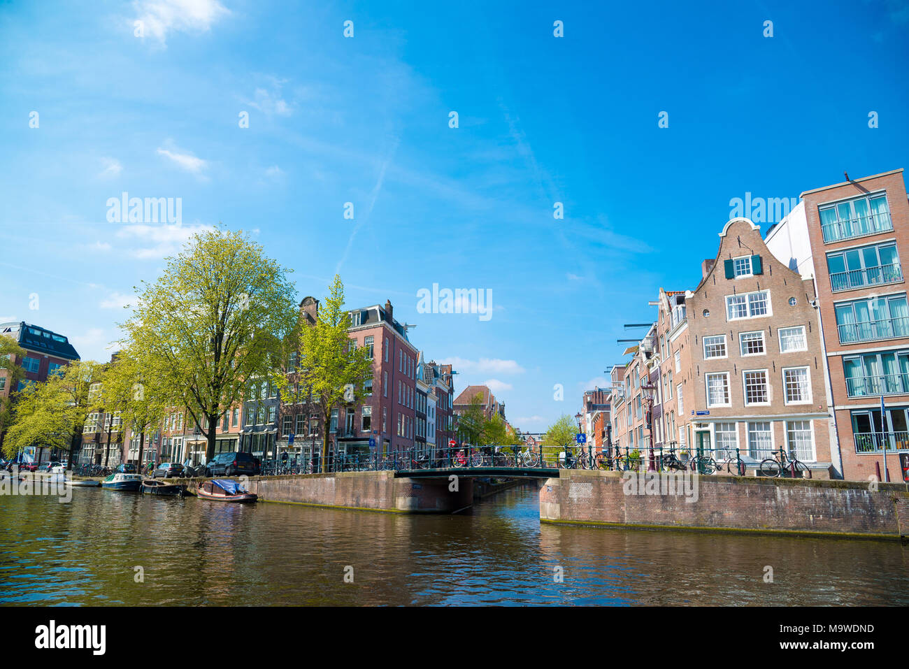 Amsterdam, Netherlands - April 20, 2017: Amsterdam canal and beautiful traditional old buildings, Netherlands Stock Photo