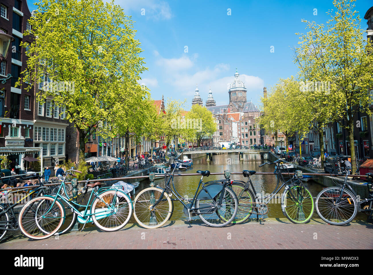 Amsterdam, Netherlands April 20, 2017 Bikes on the bridge in Amsterdam. Canals of Amsterdam