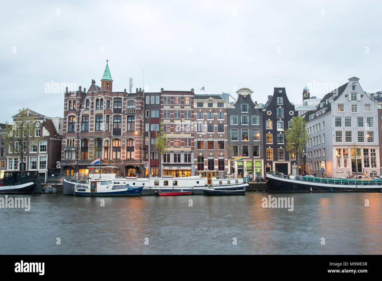 Amsterdam, Netherlands - April 21, 2017: Amsterdam canal and beautiful traditional old buildings, Netherlands Stock Photo