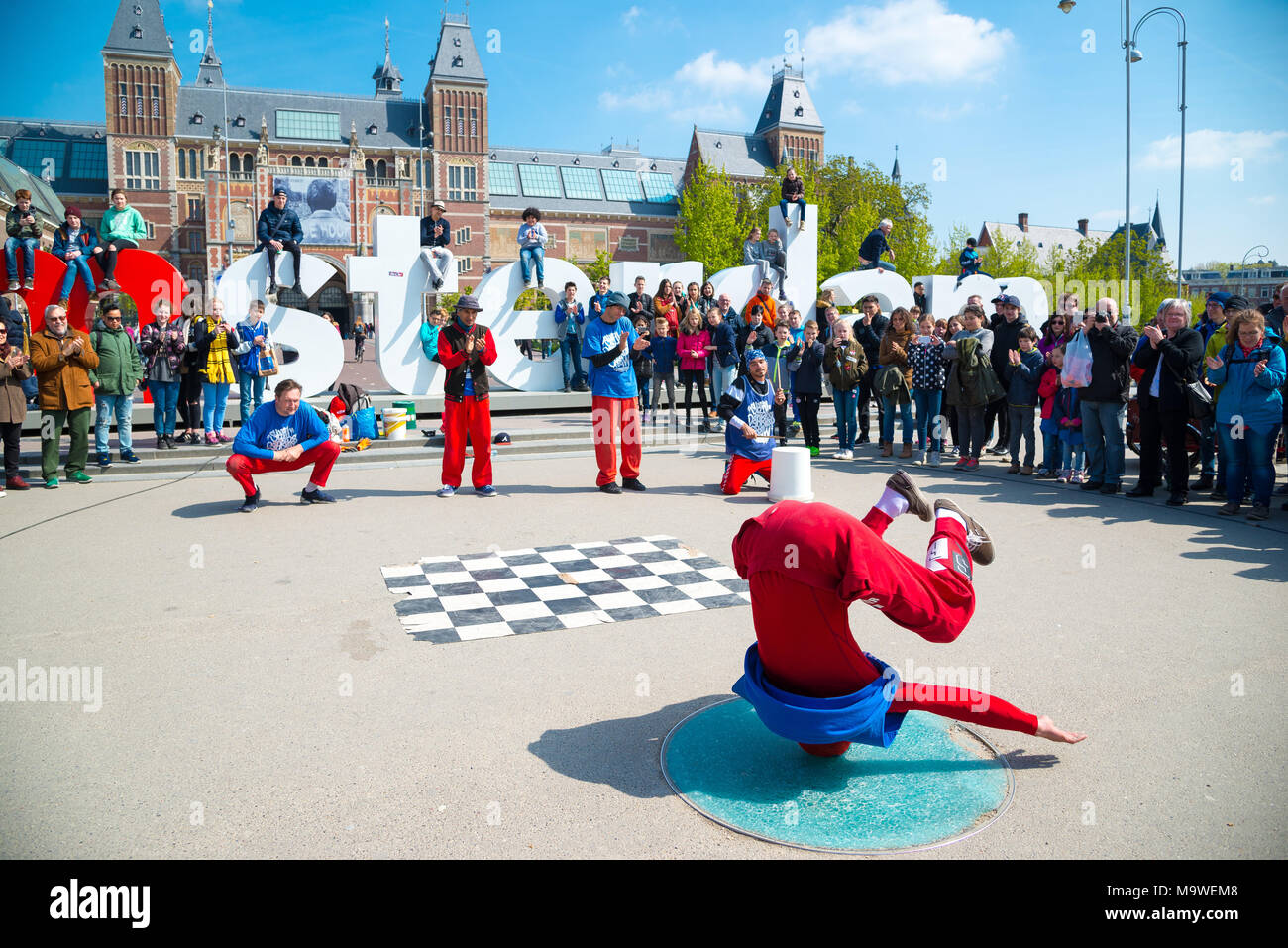 Amsterdam, Netherlands - April 20, 2017: Youth break dancing on city streets in Amsterdam. Street festival breakdance. Stock Photo
