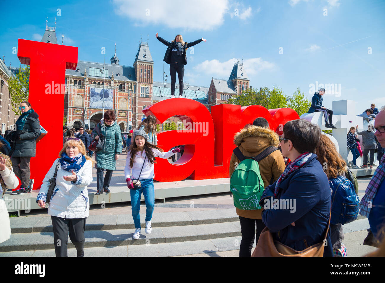 Amsterdam, Netherlands - April 20, 2017: Rijksmuseum and Statue I am Amsterdam at day, Netherlands Stock Photo