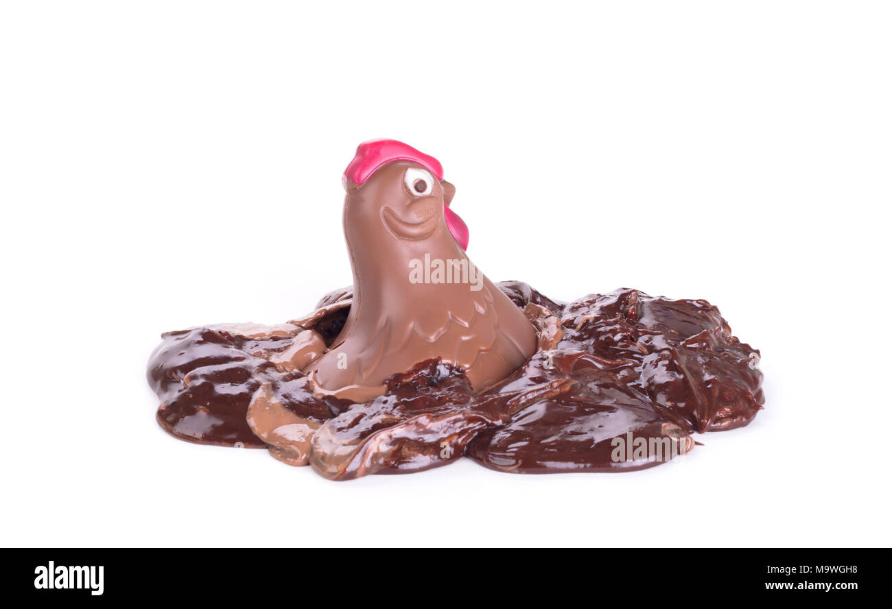 Melting chocolate easter chicken - Isolated on white background Stock Photo
