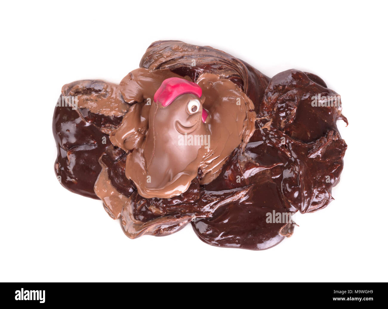 Melting chocolate easter chicken - Isolated on white background Stock Photo