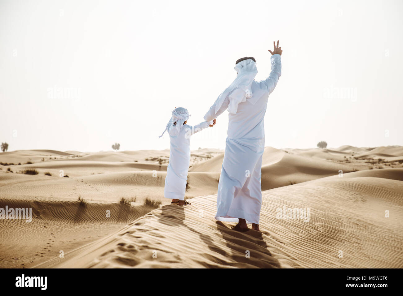 Father and son spending time in the desert Stock Photo - Alamy