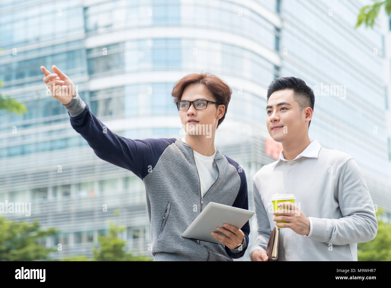 Two male coworkers walking hi-res stock photography and images - Alamy