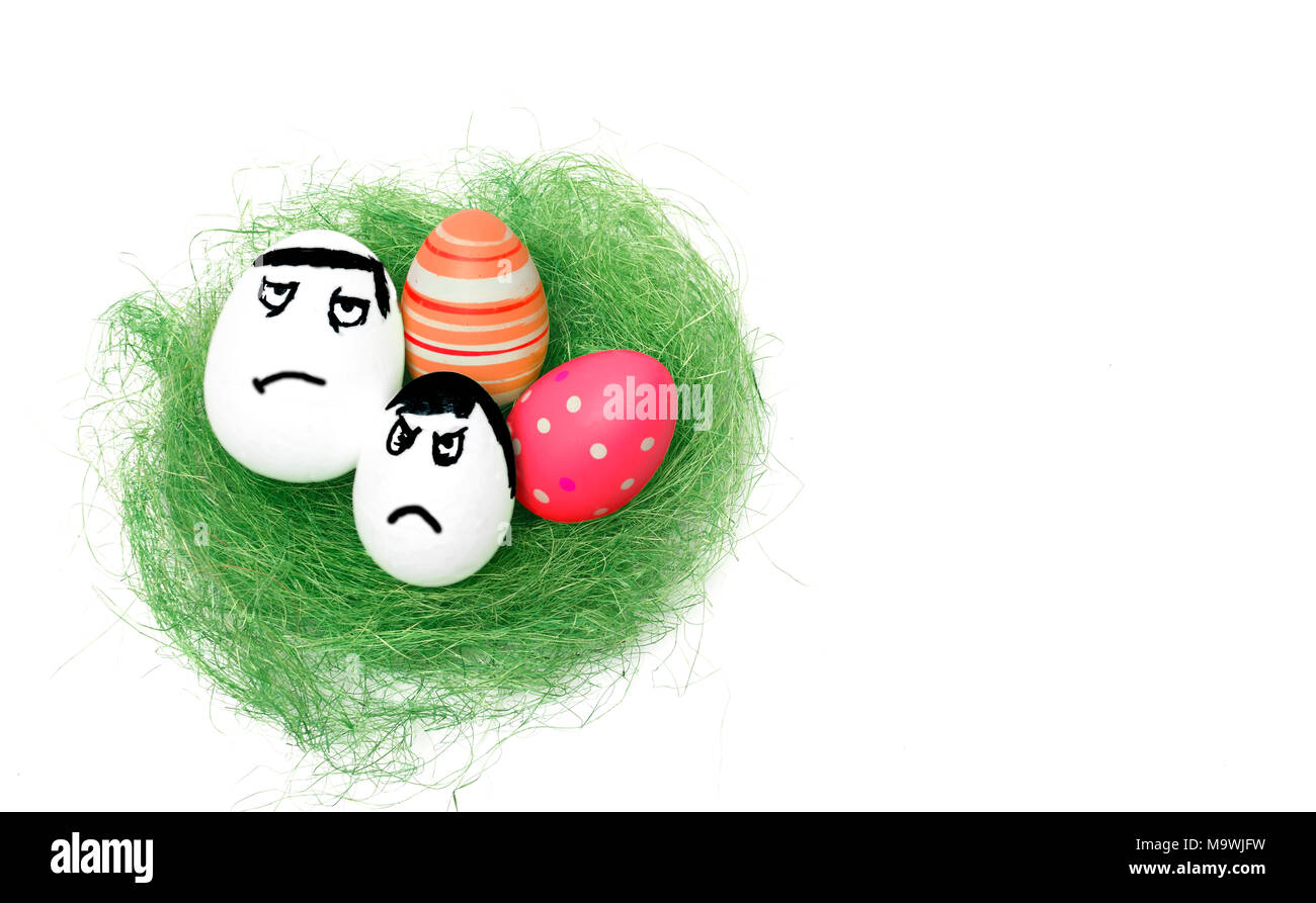 Anger eggs hidden in the grass. Easter funny eggs, Commando eggs, revenge Stock Photo