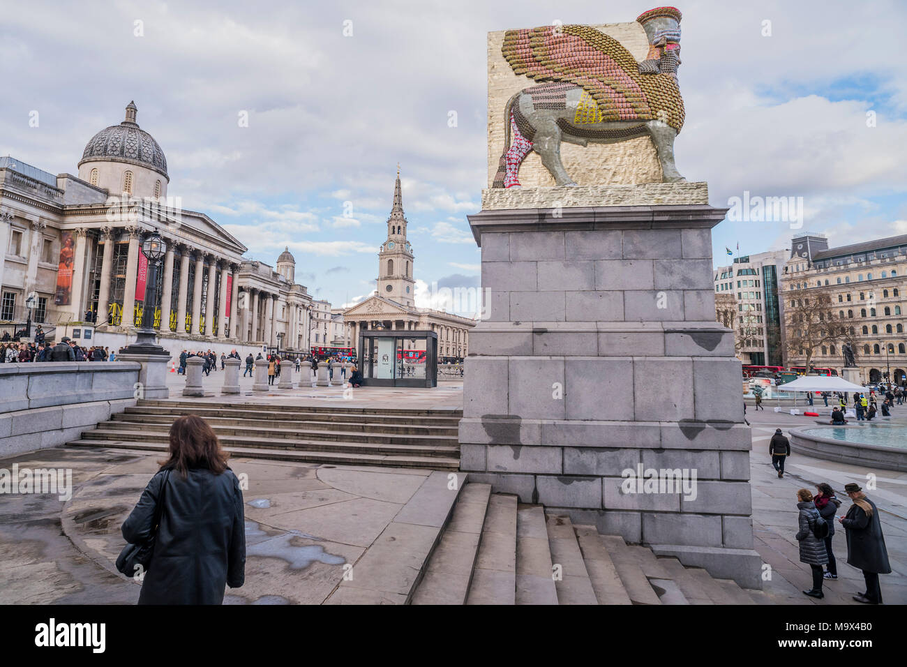 London, UK. 28th March, 2018. The Invisible Enemy Should Not Exist, the latest artwork for the fourth plinth at Trafalgar Square, by Artist Michael Rakowitz. It is designed as a tribute to “something good in the human spirit” and as a recreation of a statue destroyed by ISIS in 2015. The sculpture, which shows a mythical winged beast called a Lamassu, is 4.5 metres high, took four months to build and is made up of 10,500 empty Iraqi date syrup cans symbolising one of the country’s former thriving industries shattered by war. Credit: Guy Bell/Alamy Live News Stock Photo