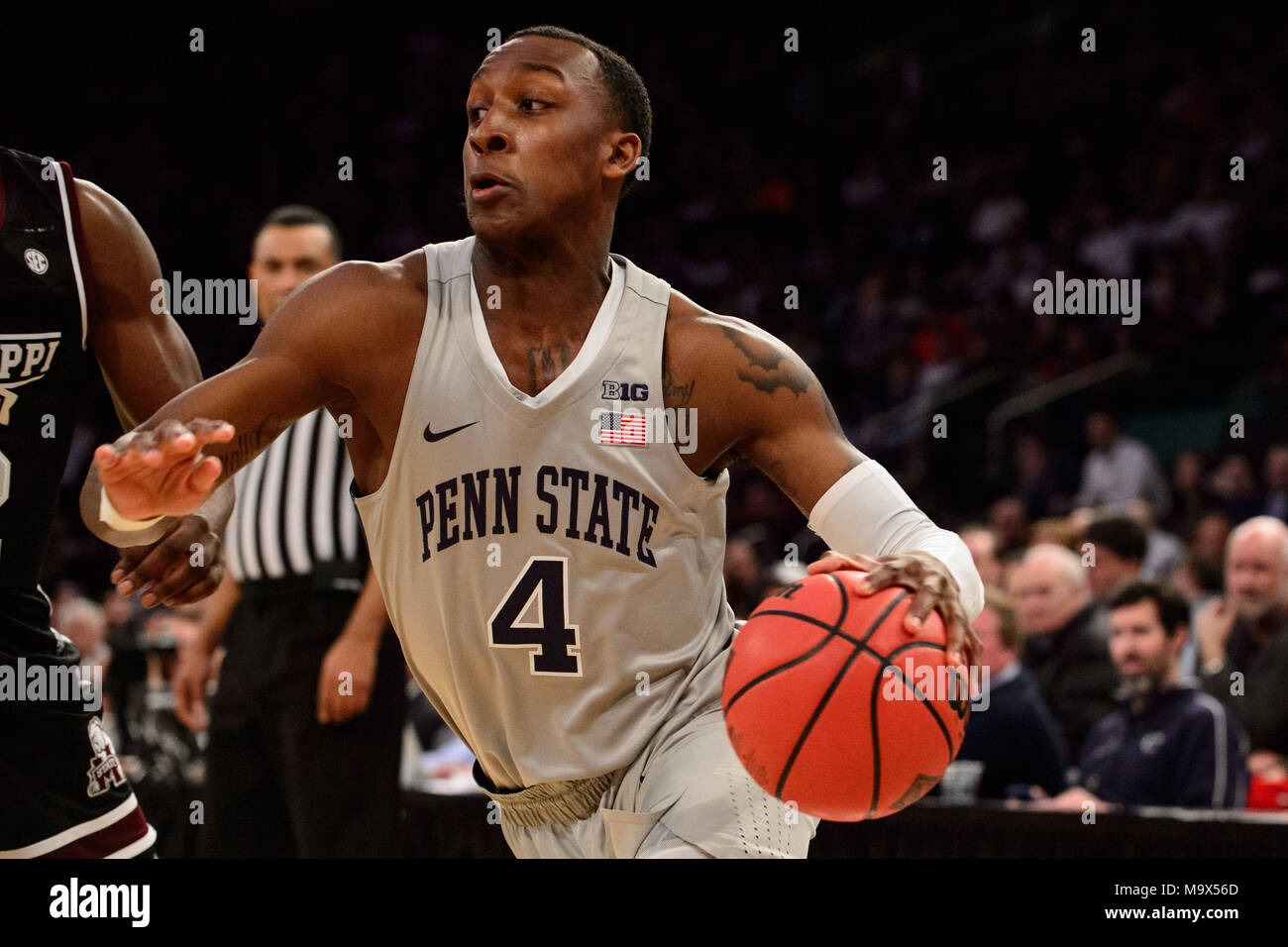 March 27, 2018: Penn State Nittany Lions guard Nazeer Bostick (4) drives to the basket at the semi-final of the NIT Tournament game between The Penn State Nittany Lions and The Mississippi State Bulldogs at Madison Square Garden, New York, New York. Mandatory credit: Kostas Lymperopoulos/CSM Stock Photo