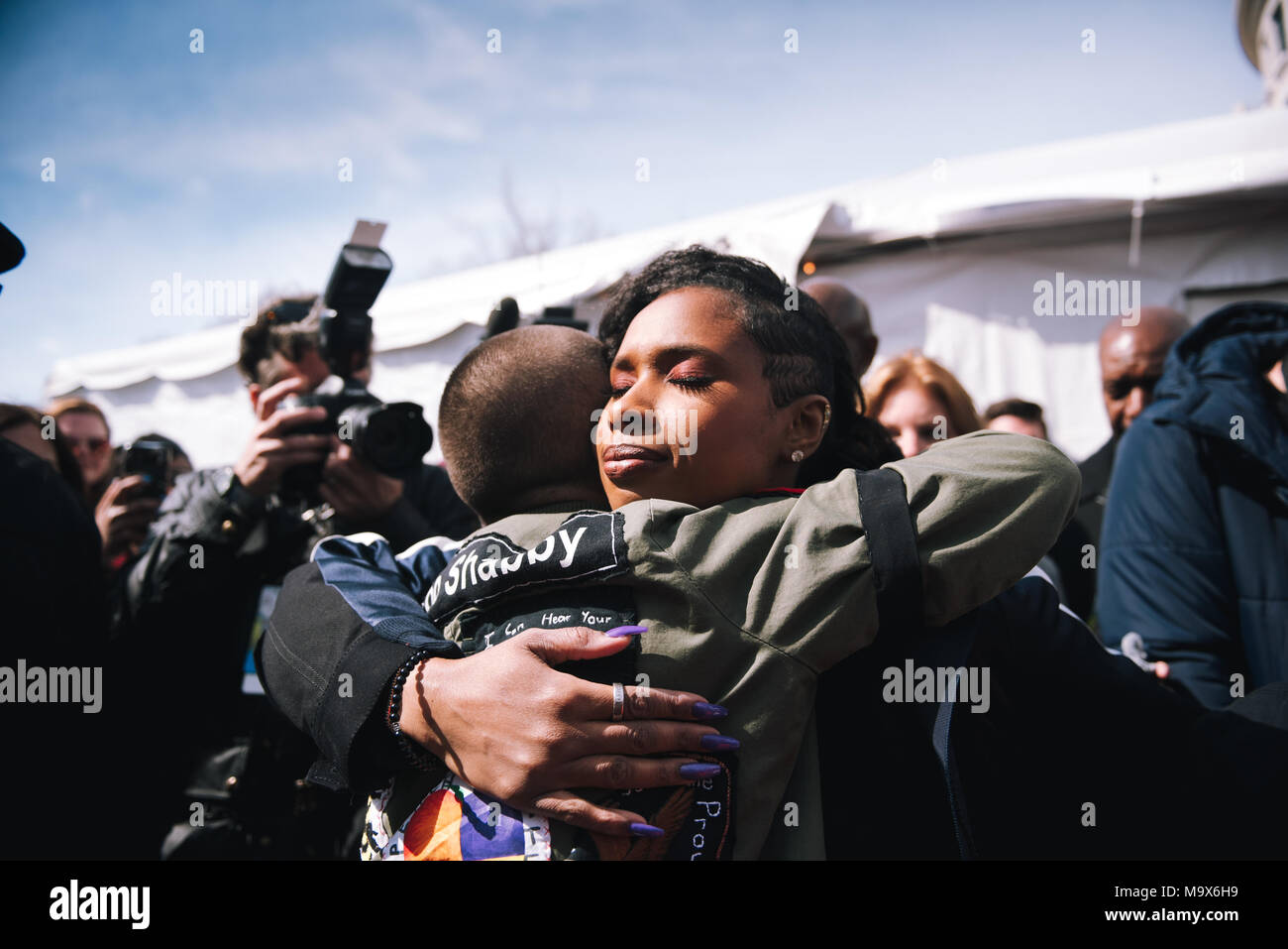 Washington Dc, USA. 24th Mar, 2018. Jennifer hudson embraces Emma Gonzalez after their time on stage after March for our lives.Tens of thousands of Americans took to the street on Washington DC during the ''March for our Lives'' demonstration against gun violence in schools in the United States. Credit: Emilee Mcgovern/SOPA Images/ZUMA Wire/Alamy Live News Stock Photo