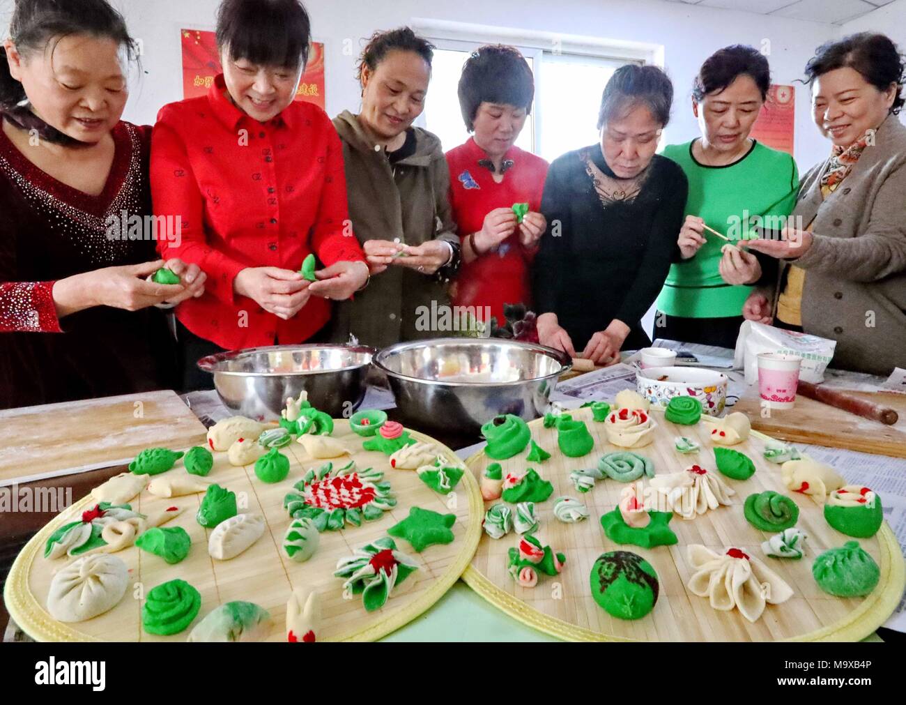 Qinhuangdao, Qinhuangdao, China. 29th Mar, 2018. Qinhuangdao, CHINA-29th March 2018: People make traditional food to celebrate Cold Food Festival in Qinhuangdao, north China's Hebei Province. The Cold Food or Hanshi Festival is a traditional Chinese holiday which developed from the local commemoration of the death of the Jin nobleman Jie Zhitui in the 7th century BC under the Zhou into an East Asian occasion for the commemoration and veneration of ancestors by the 7th-century Tang. The lighting of fire was avoided, even for the preparation of food. This practice originally occurred at midwint Stock Photo