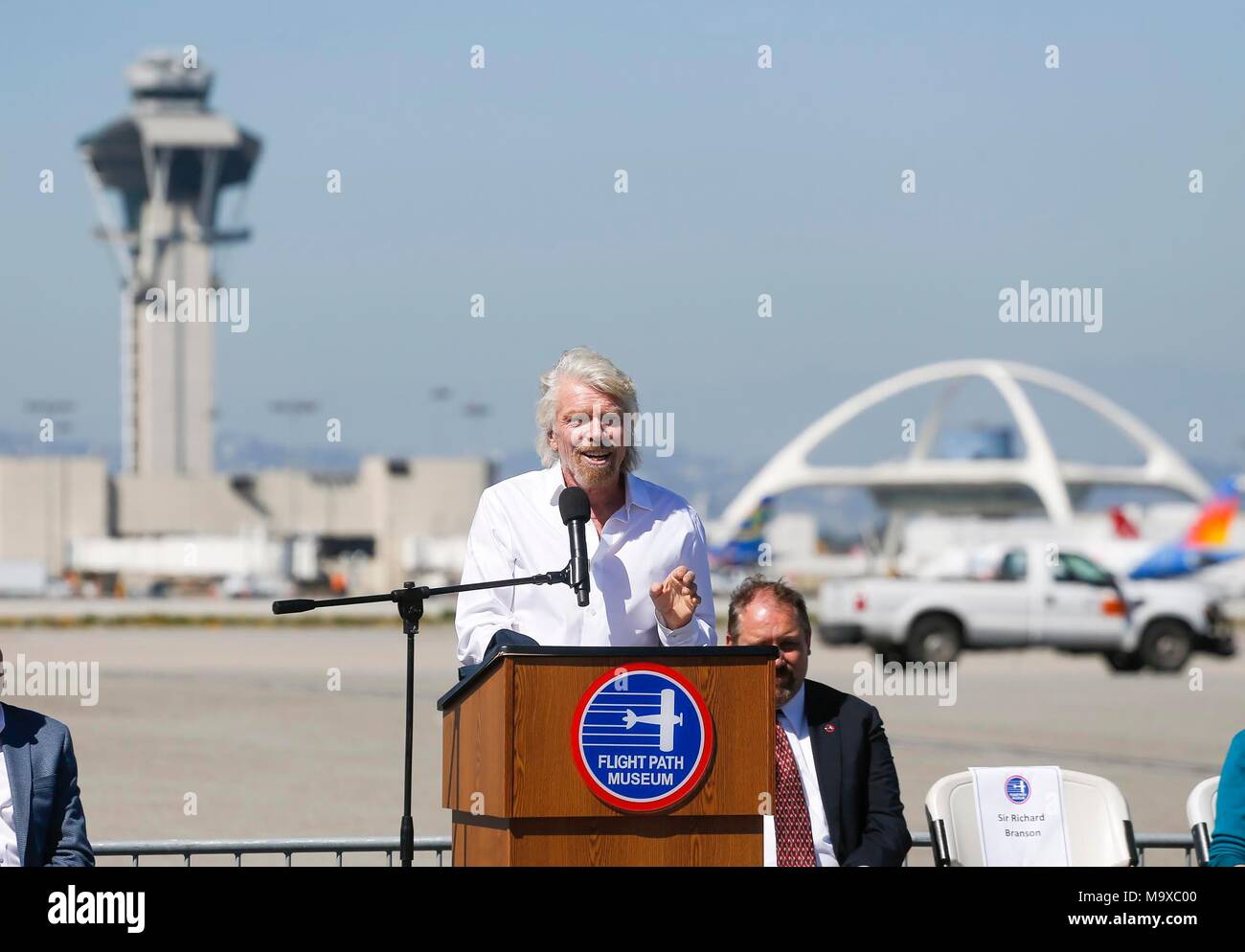 Los Angeles, USA. 28th Mar, 2018. Richard Branson (front), founder of the Virgin Group, speaks as he is inducted into the Flight Path Walk of Fame at Los Angeles International Airport in Los Angeles, the United States, March 28, 2018. Credit: Zhao Hanrong/Xinhua/Alamy Live News Stock Photo