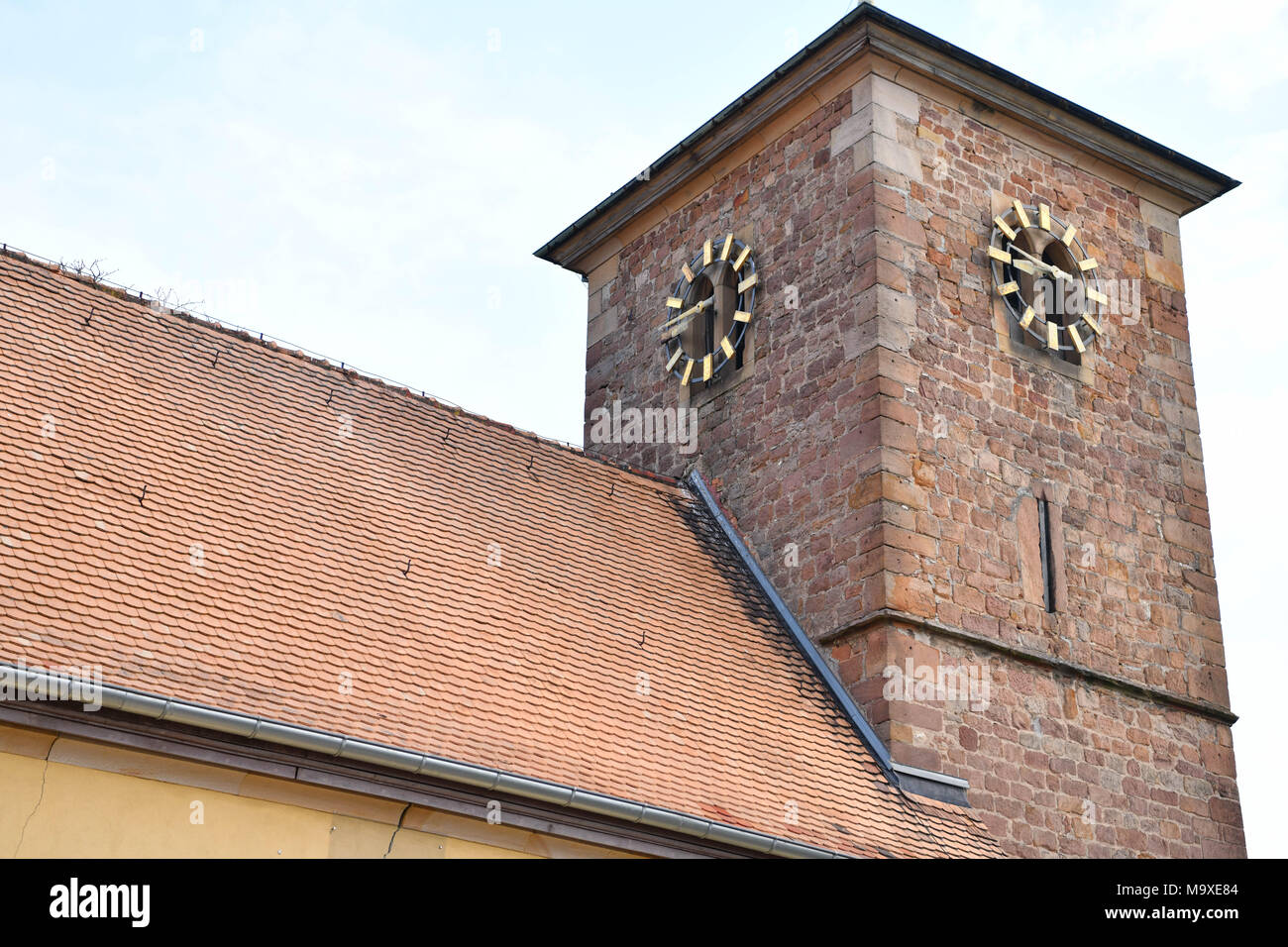 27 March 2018, Germany, Herxheim am Berg: Picture of the evangelical Jakobskirche church's tower. Photo: Uwe Anspach/dpa Stock Photo