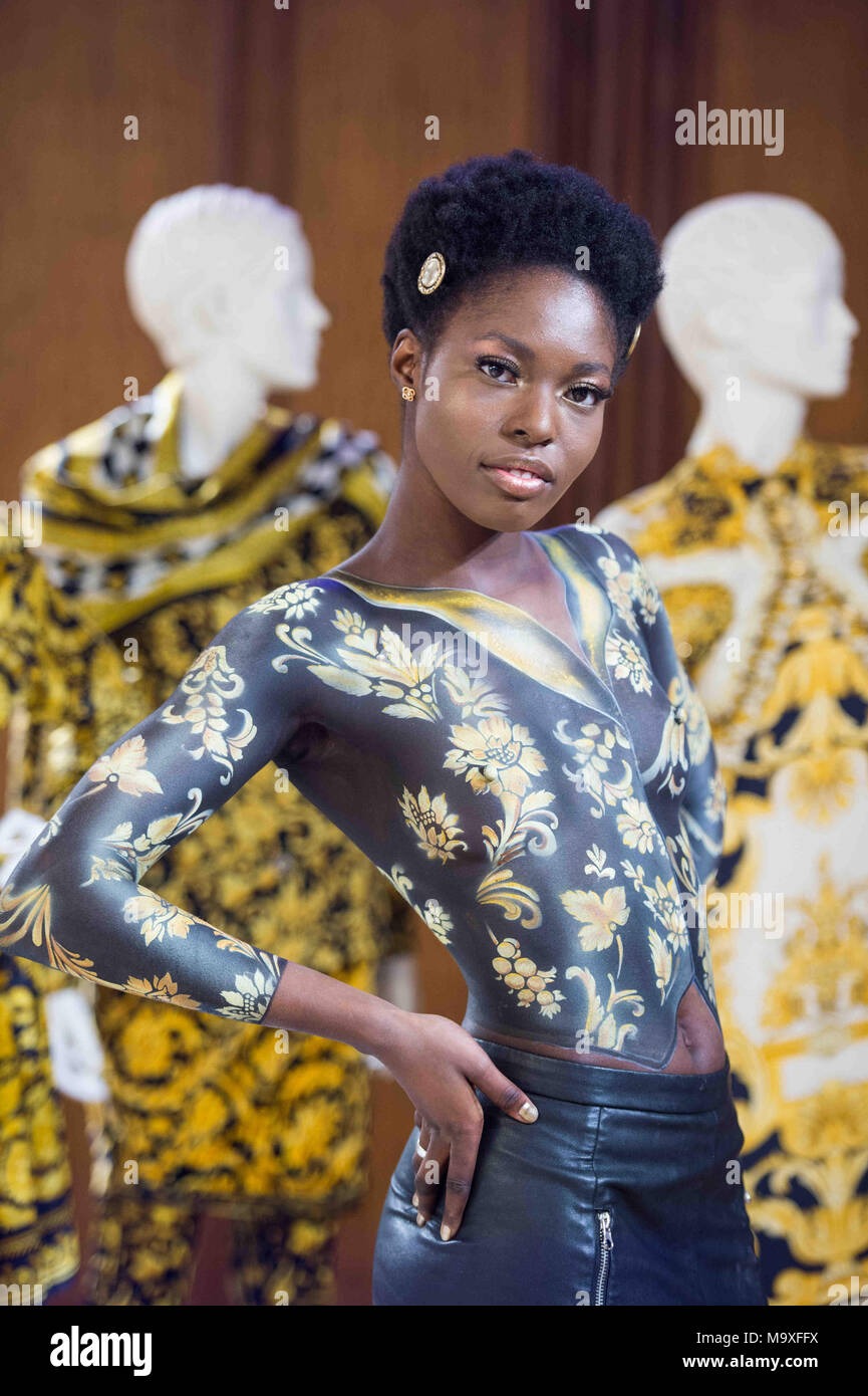 Model poses during body painting hi-res stock photography and images ...