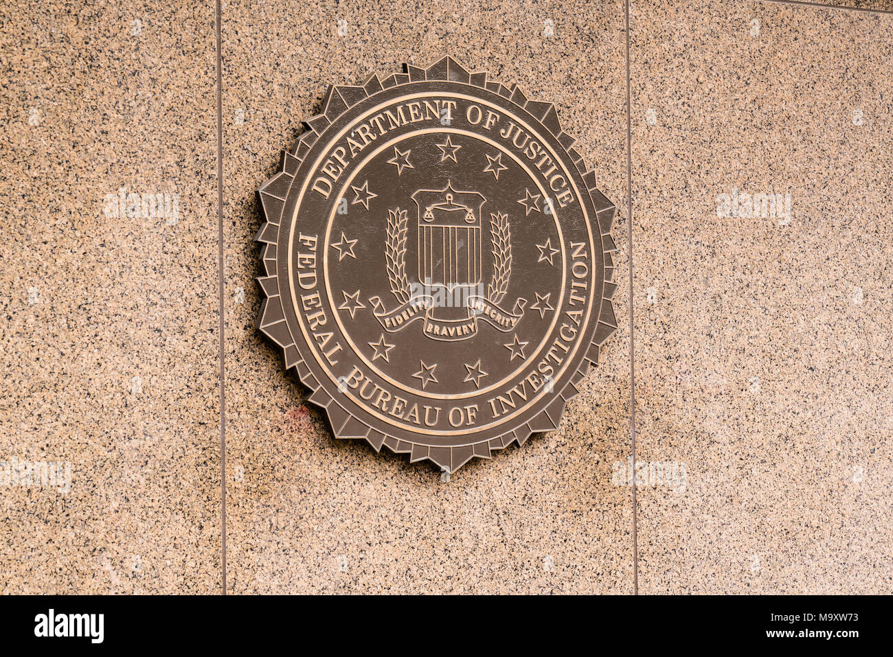WASHINGTON, DC - MARCH 14, 2018: Seal of the Federal Bureau of Investigation on the J. Edgar Hoover FBI Building in Washington, DC Stock Photo