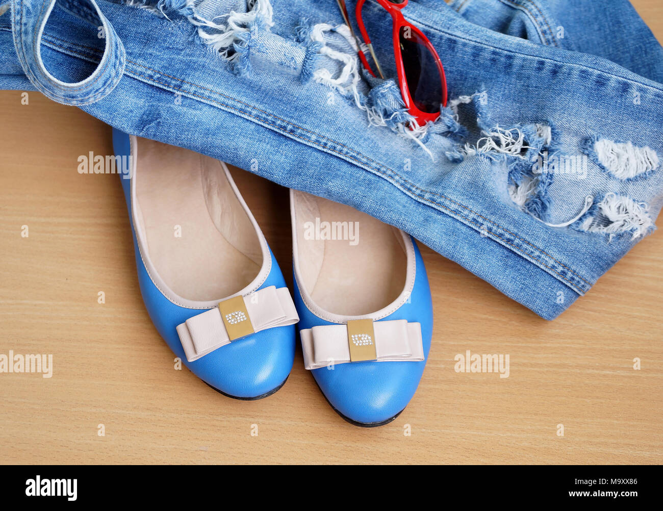 Turquoise women's shoes "court shoes" with jeans overalls Stock Photo Alamy