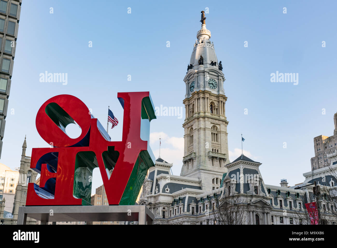 PHILADELPHIA, PA - MARCH 10, 2018: Newly restored LOVE sculpture and City Hall from Love Park in Philadelphia, Pennsylvania Stock Photo