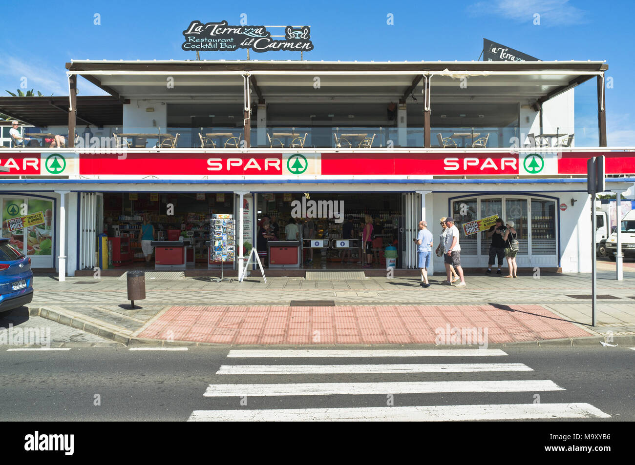 dh Shops PUERTO DEL CARMEN LANZAROTE Spanish Spar supermarket aboard shop front doors Stock Photo