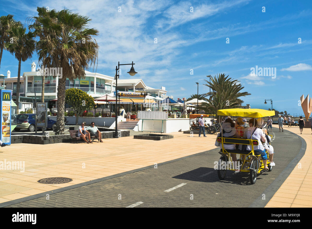 dh Promenade MATAGORDA LANZAROTE Holiday tourist pedalling quadracycle people seafront prome Stock Photo