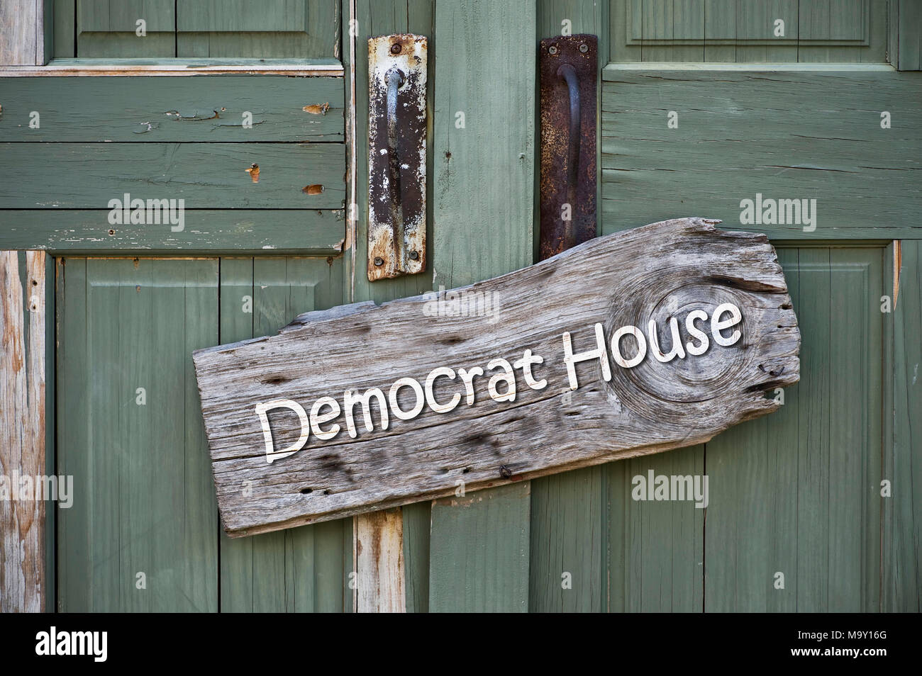 Democrat house sign on old green doors. Stock Photo