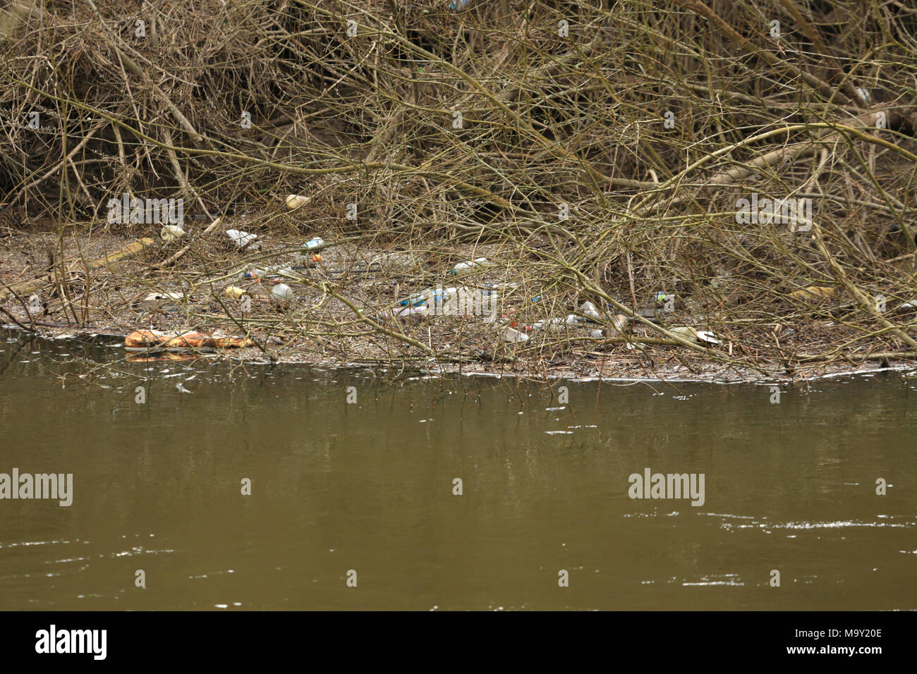 Plastic and other waste on the banks of the river Severn near Bewdley, Worcestershire, uk. Stock Photo