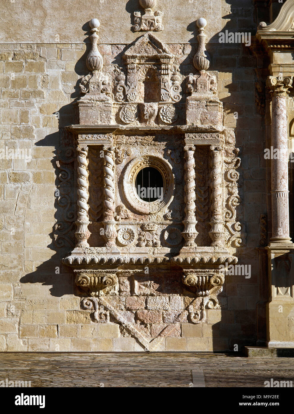 Royal Abbey of Santa Maria de Poblet. Cistercian monastery. Church of Saint Mary. Oval window added in the 18th century with Baroque ornamentation and Salomonic columns. Vimbodi, province of Tarragona. Catalonia, Spain. Stock Photo
