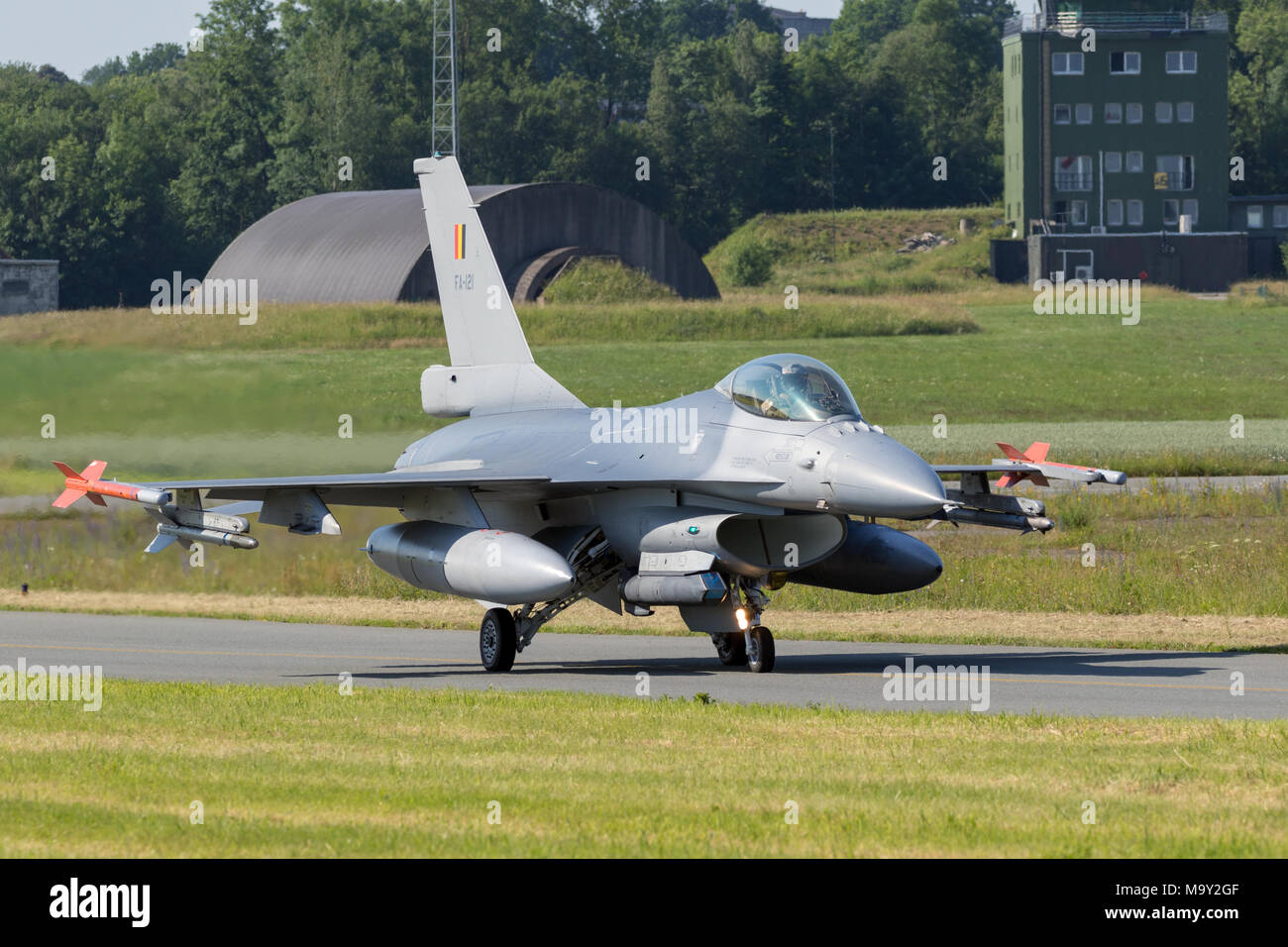 FLORENNES, BELGIUM - JUN 15, 2017: Belgian Air Force F-16 fighter jet plane taxiing to the runway of Florennes airbase. Stock Photo