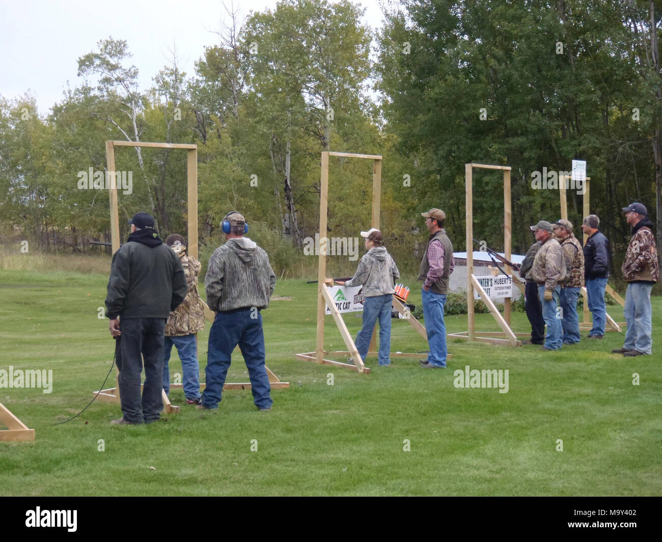 youth trap shooting. Youth hunters shooting clay targets the night