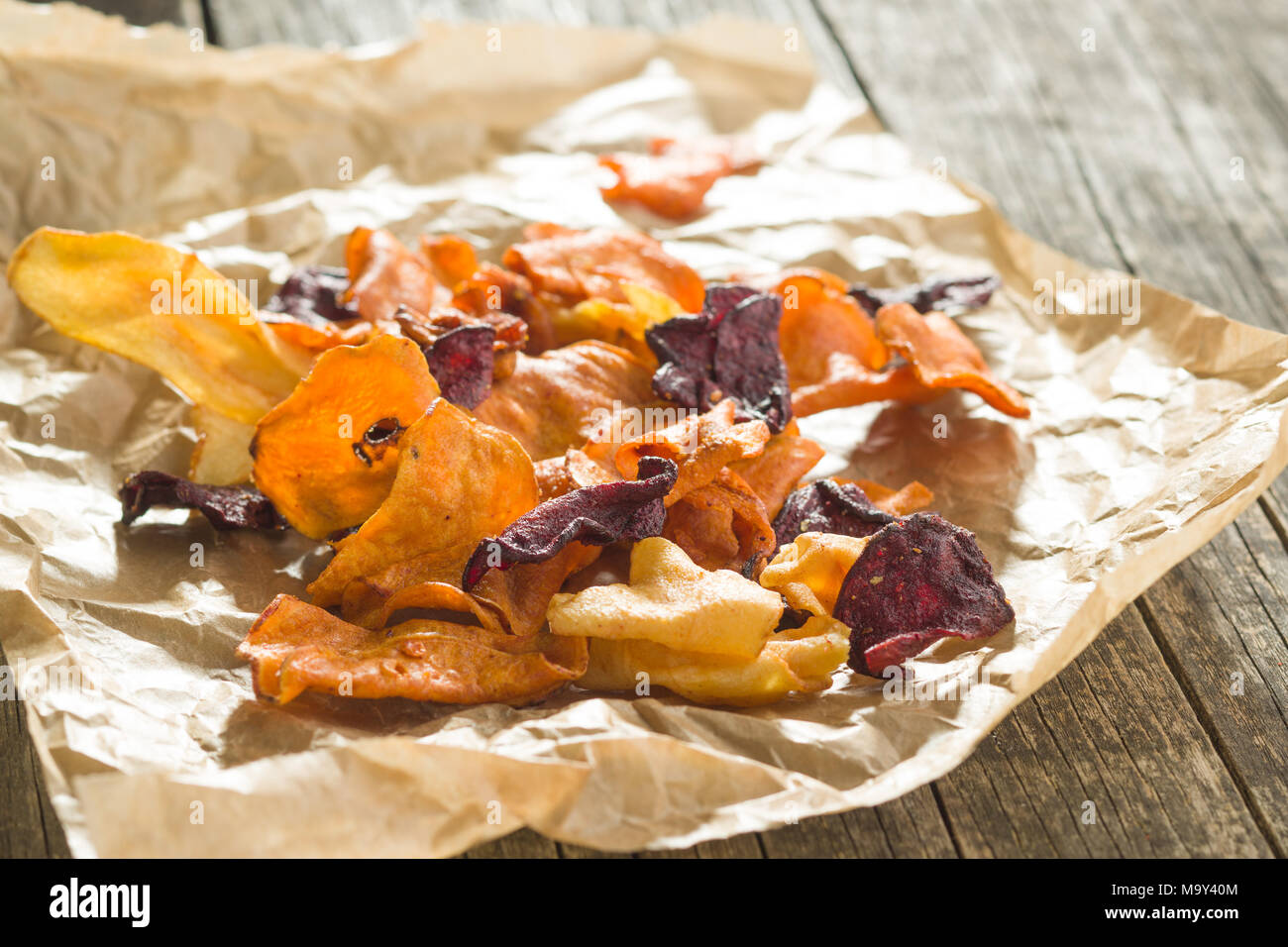 Mixed fried vegetable chips on old table Stock Photo Alamy