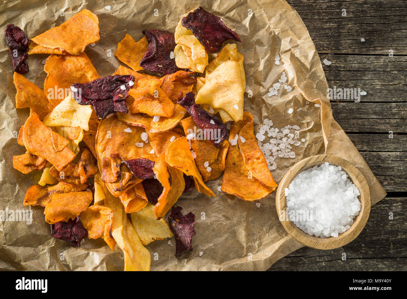 Mixed fried vegetable chips and salt on old table Stock Photo Alamy