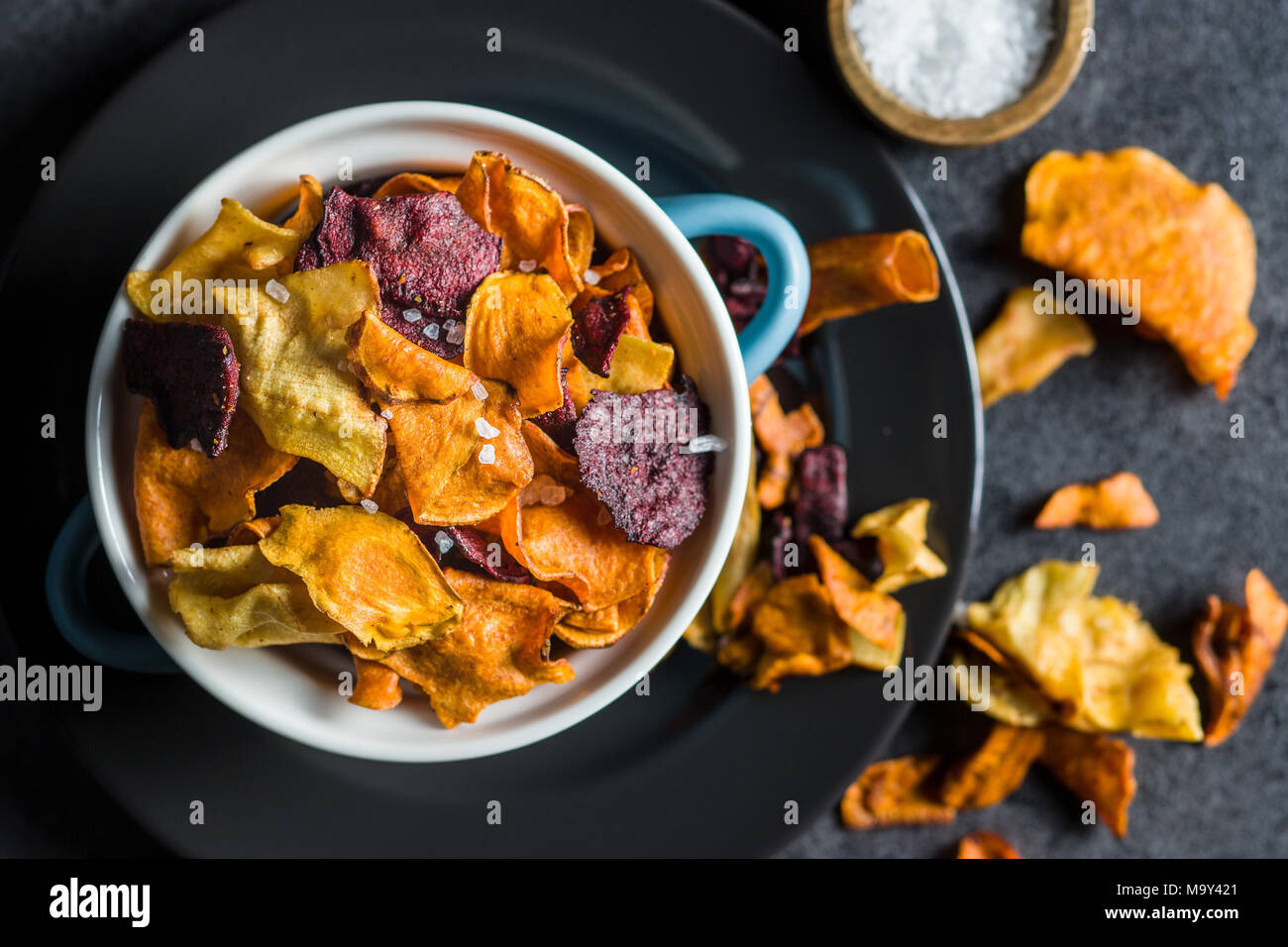 Mixed fried vegetable chips in pot. Stock Photo